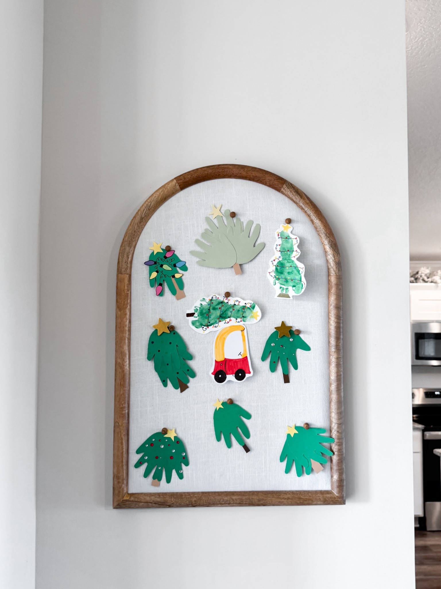 targets new spring time arched bulletin board! i have last years version, but this year version is super cute too!! such a cute way to display kids arts and crafts, mail, cards, or just to use casually! 
this is a staple statement piece in our home!

#LTKmomlife #LTKHome #LTKSeasonal