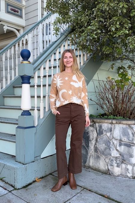 Brown flared wide leg pants paired with square toe ankle boots and a statement sweater. This outfit is cute, comfortable and can work for many occasions