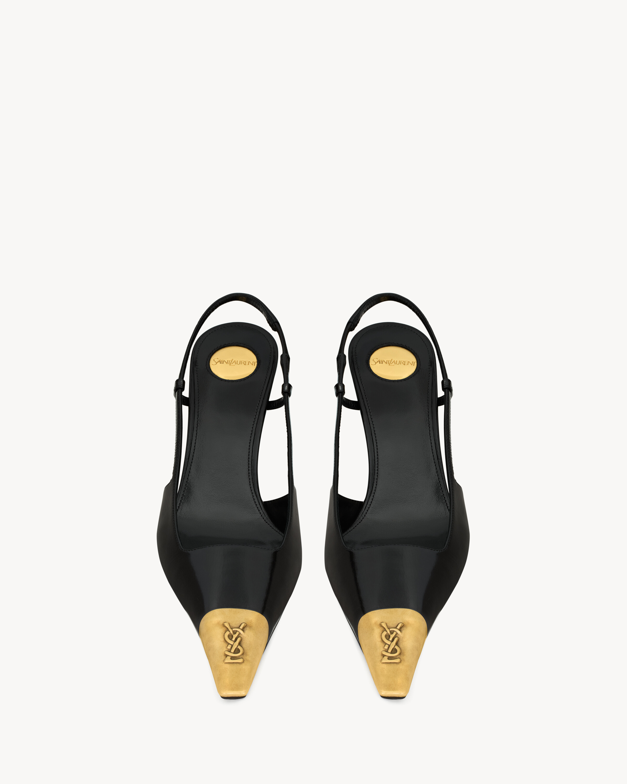 slingback pumps with a square pointed metal cap toe decorated with a CASSANDRE martel\u00e9, feat... | Saint Laurent Inc. (Global)