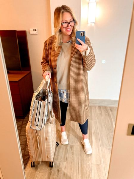 What I Wore: Plus Size Travel OOTD.  This is what I wore on a recent flight! I felt so chic and comfy at the same time! Wearing a pair of cropped leggings from Spanx (use code ASHLEYDXSPANX for a discount) in a size 2X, a button-down tunic top from maurices in a size 3X layered with an AirEssentials crew neck sweatshirt from Spanx in a size 3X (use code ASHLEYDXSPANX for a discount), a wool blend coat from Abercrombie (XXL) and my On Cloud sneakers! Linked luggage and similar bag as well! 

#LTKSeasonal #LTKcurves #LTKtravel