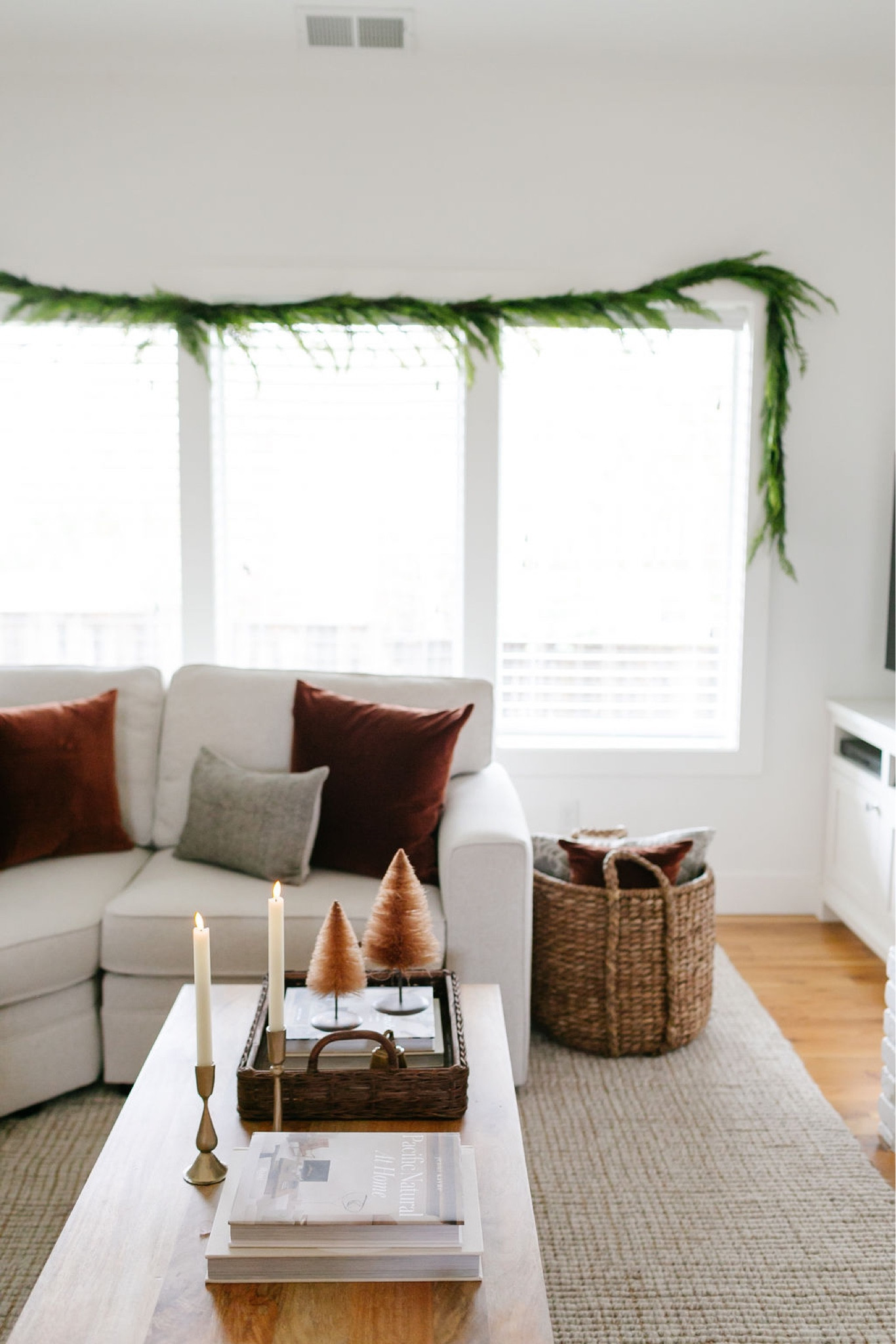 Want an idea for a super simple Christmas coffee table idea?  Brass candleholders, real-wax flameless candles, bottlebrush trees. Coffee table books & a basket  

#LTKhome #LTKsalealert #LTKHoliday
