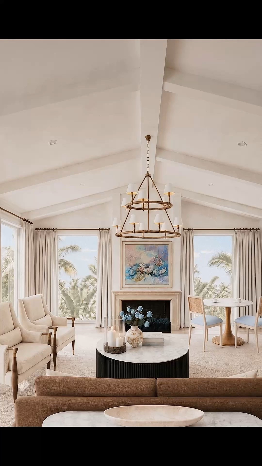 This living room was designed around timeless sophistication, beautiful natural light, and pieces that feel distinctive without overwhelming the space.

The floor-to-ceiling windows and tailored pleated drapes bring softness, height, and an elegant sense of movement to the architecture. Framing the fireplace, the Arhaus Fisher Chairs introduce a modern-classic silhouette with an open back, beautifully shaped wood frame, and refined brass detailing along the arms and tapered legs. They feel structured and tailored, yet still comfortable and inviting.

Above, Serena & Lily’s two-tier Madera Chandelier beautifully fills the volume of the high ceiling. Its layered silhouette gives the room presence while keeping the overall feeling light, polished, and timeless.

The mantel, hand-painted artwork, soft area rug, and warm brown sofa add depth and balance. Behind the sofa, the Arhaus Finnley Media Console is both stylish and functional. Its reeded wood, marble top, and brass details help define the living area, while the drawers provide practical hidden storage and the surface creates another place to display beautiful objects.

By the windows, Serena & Lily’s Southampton table pairs honed marble with a sculptural, hand-wrapped rattan coil base. Paired with the dining chairs, it creates an intimate, light-filled place for coffee, conversation, or a relaxed meal at any time of day.

Sophisticated, timeless, functional, and beautifully illuminated by the soft afternoon sunlight.

#LivingRoomDesign #LivingRoomInspiration #ModernClassic #TimelessInteriors #SophisticatedInteriors #HighCeilingLivingRoom #FloorToCeilingWindows #PleatedDrapes #WindowTreatments #AccentChair #FisherChair #Arhaus #MaderaChandelier #SerenaAndLily #StatementLighting #Chandelier #FireplaceDesign #MantelDecor #Artwork #AreaRug #SofaStyle #ConsoleTable #FinnleyConsole #StorageConsole #SouthamptonTable #DiningNook #RattanFurniture #MarbleTable #AfternoonLight #HomeDecor 

Comment SHOP below to receive a DM with links to shop this design.

#LTKHome #LTKdayinmylife #LTKSaleAlert #LTKHome