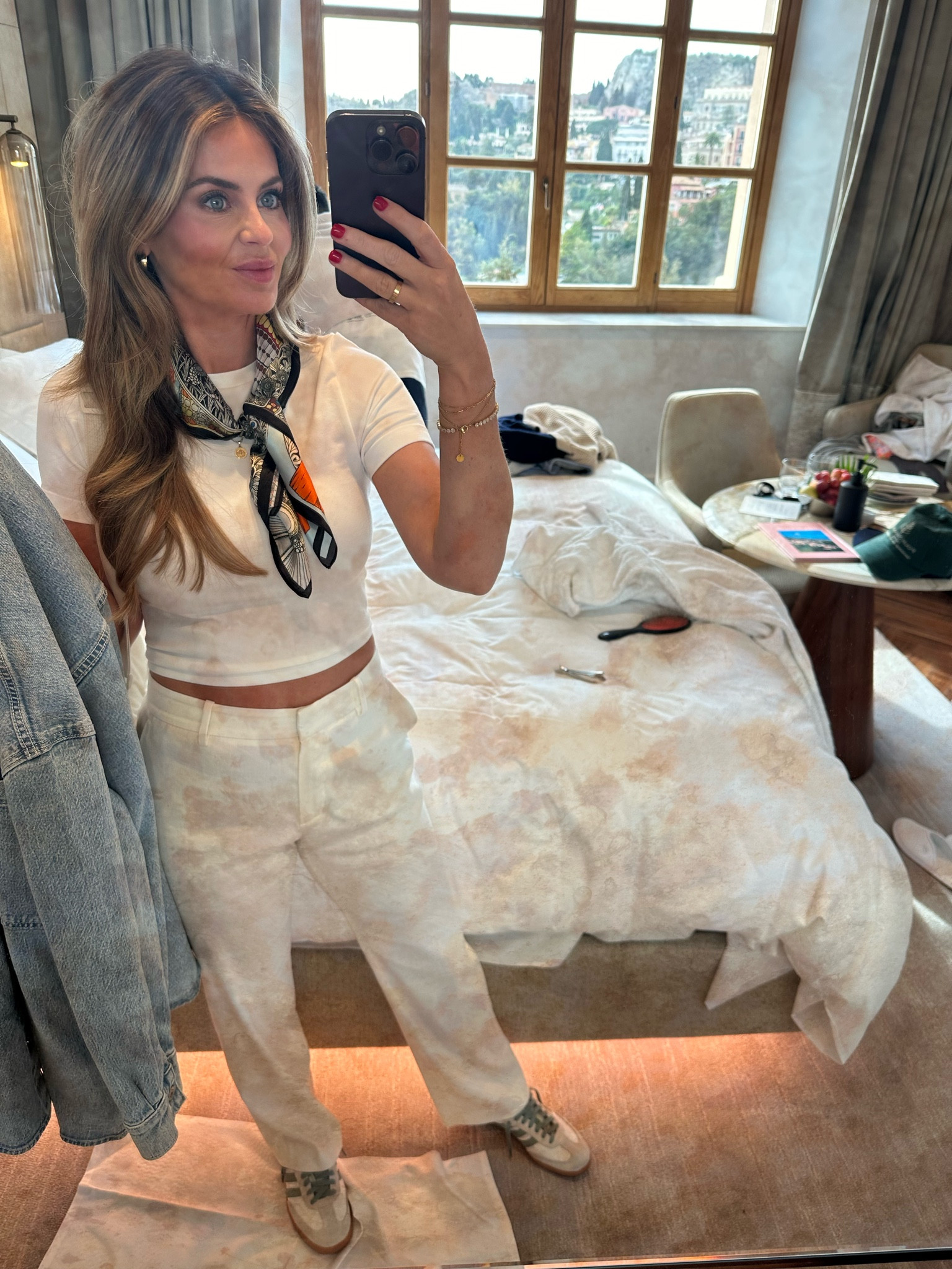 White linen pants, silk scarf, denim jacket, sambas