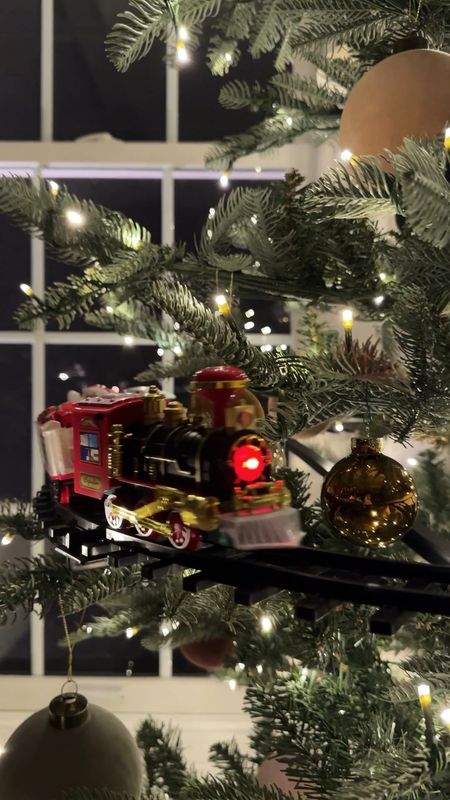 If this elevated tree train track ain’t the cutest thing then what is?!? Our boys are OBSESSED. It attaches directly to the tree base and the train chugs around. It’s perfect if you want a train that your kids or dogs won’t break/constantly take off the tracks if on the ground! Such a magical little addition 🤗

#LTKHoliday #LTKhome #LTKVideo