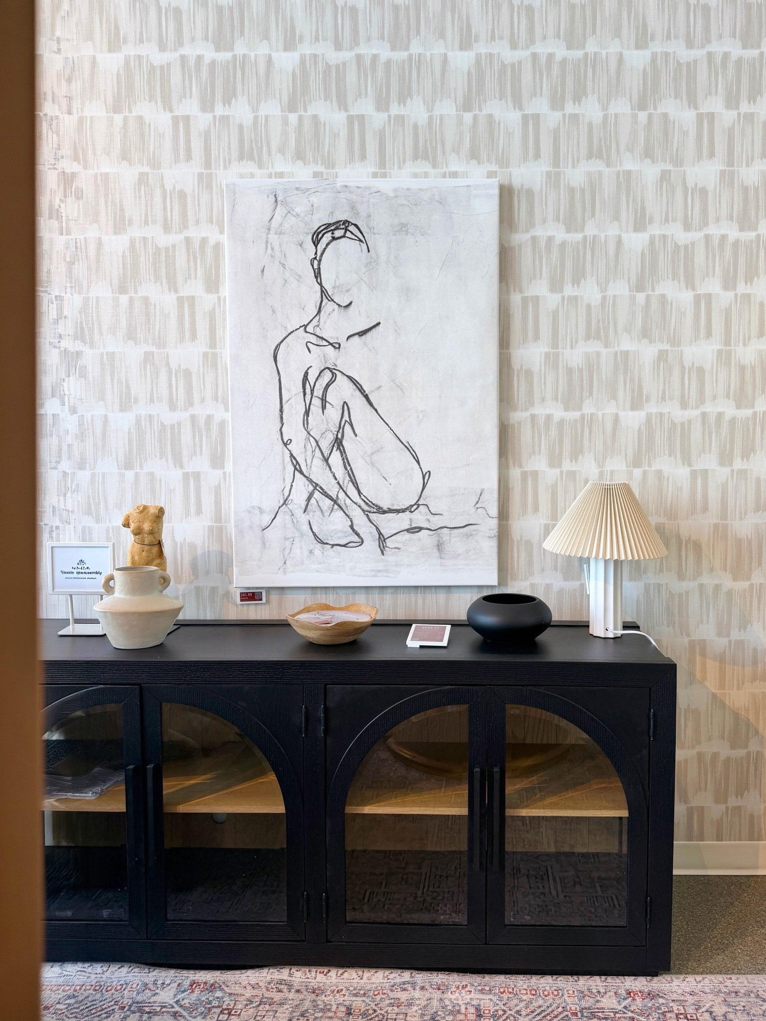 Modern chic sideboard moment with Wayfair finds! 🖤✨ I love this black arched wood and glass console styled with elegant wallpaper and layered wall art for a look that feels modern, glamorous, and effortlessly sophisticated. 💫 The mix of bold pattern, sleek black finishes, and curated décor gives the whole setup such a polished, high-end feel. 🤩 I’ve linked the entire look and similar styles in my LTK! 🫶🏻 @Wayfair #sideboard #wayfairfind #consoletable

#LTKHome #LTKSaleAlert