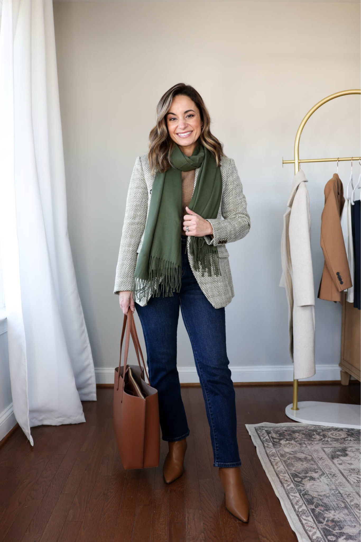 Winter workwear capsule series: outfits for work with jeans! 

This capsule has 16 pieces (not including shoes and bags) and 30 outfits! 

Herringbone blazer (banana republic factory): petite xxs 
Camel sweater (quince): xs teak 
Jeans (quince): 24x26 

Olive scarf linked is a similar option 
Tan boots are sold out (but linked in case they restock) 

My measurements for reference: 4’10” 105lbs bust, waist, hips 32”, 24”, 35” size 5 shoe. 25” inseam measurement to my ankle bone.
