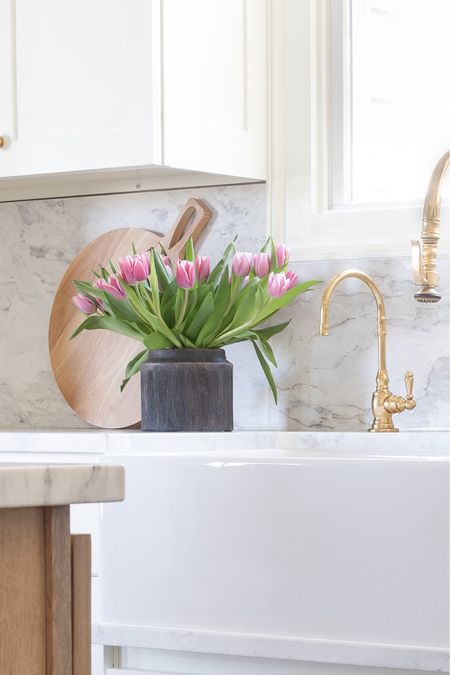 The viral Walmart black planter with pink spring tulips in kitchen. White kitchen, Amazon home decor, marble, brass faucet, wood cutting board 

#LTKSeasonal #LTKSpringSale #LTKhome