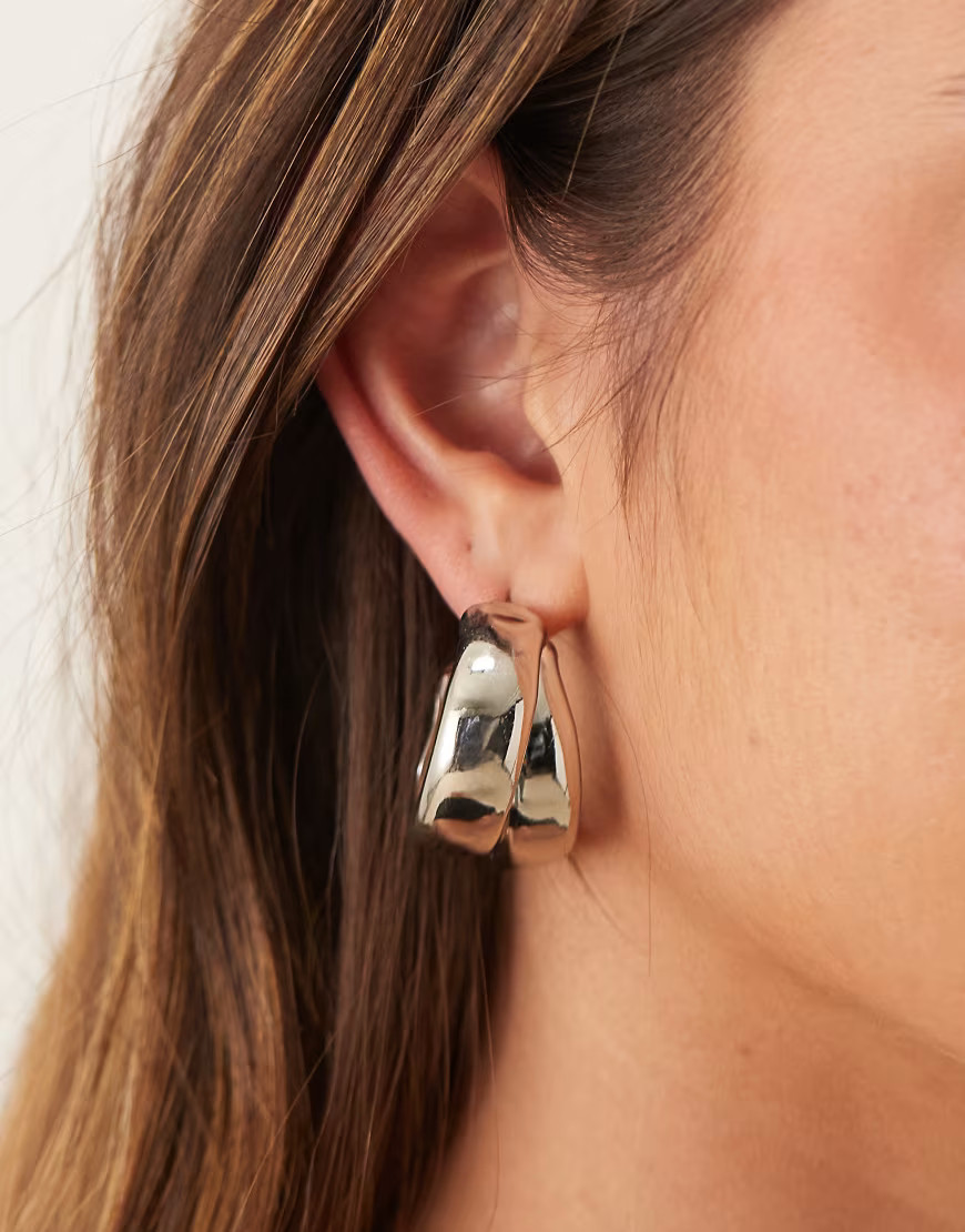 ASOS DESIGN hoop earrings with thick crossover design in silver tone | ASOS (Global)