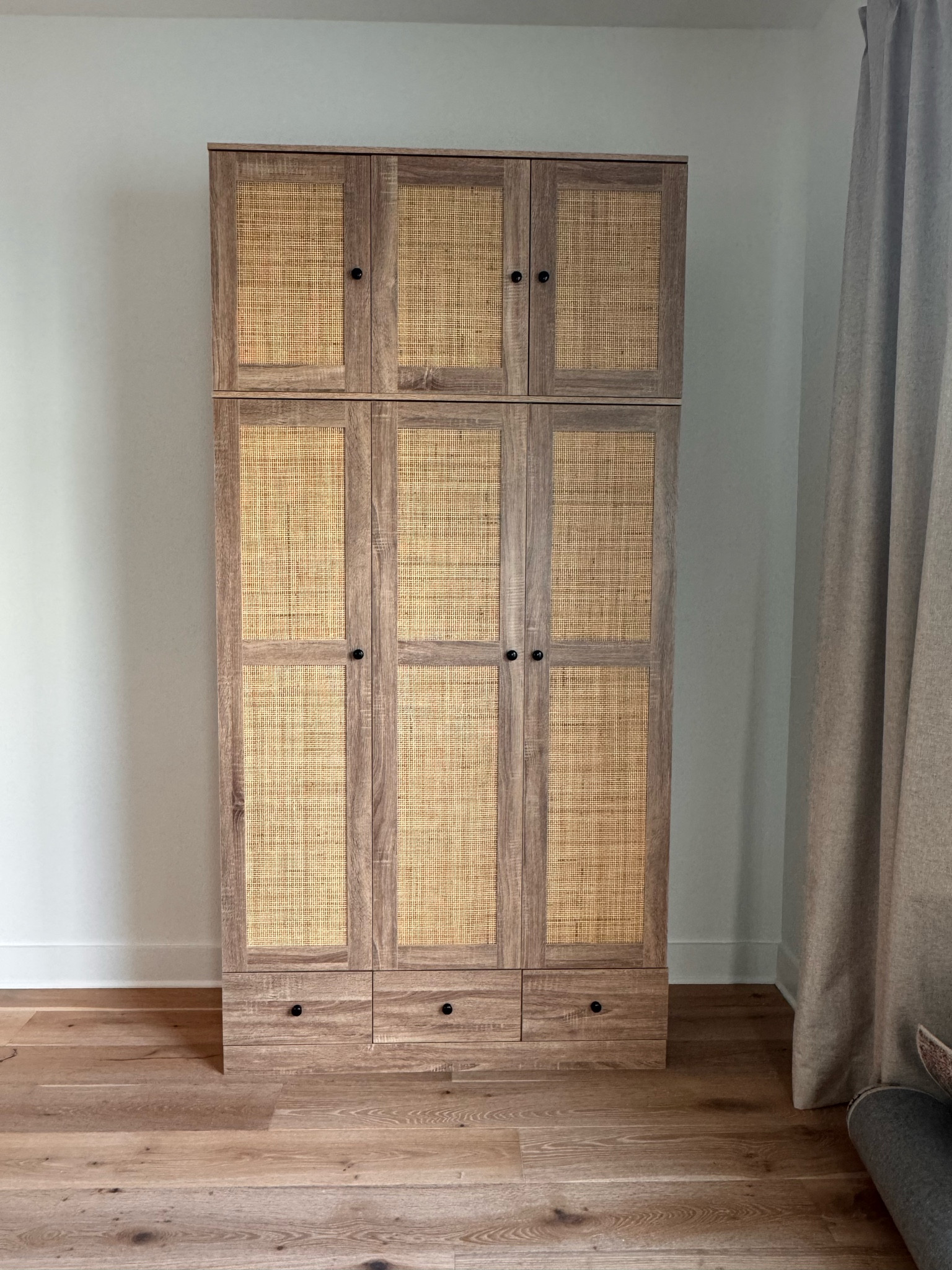 Wardrobe closet storage with rattan front. 