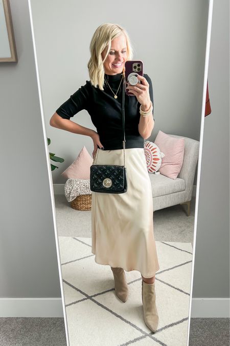 Slip skirt styled with a turtleneck top and booties. Sizing details ➡️ Top- small || skirt- xs || booties- 7.5 || purse is thrifted, linked similar 

#LTKstyletip #LTKfindsunder50 #LTKSeasonal