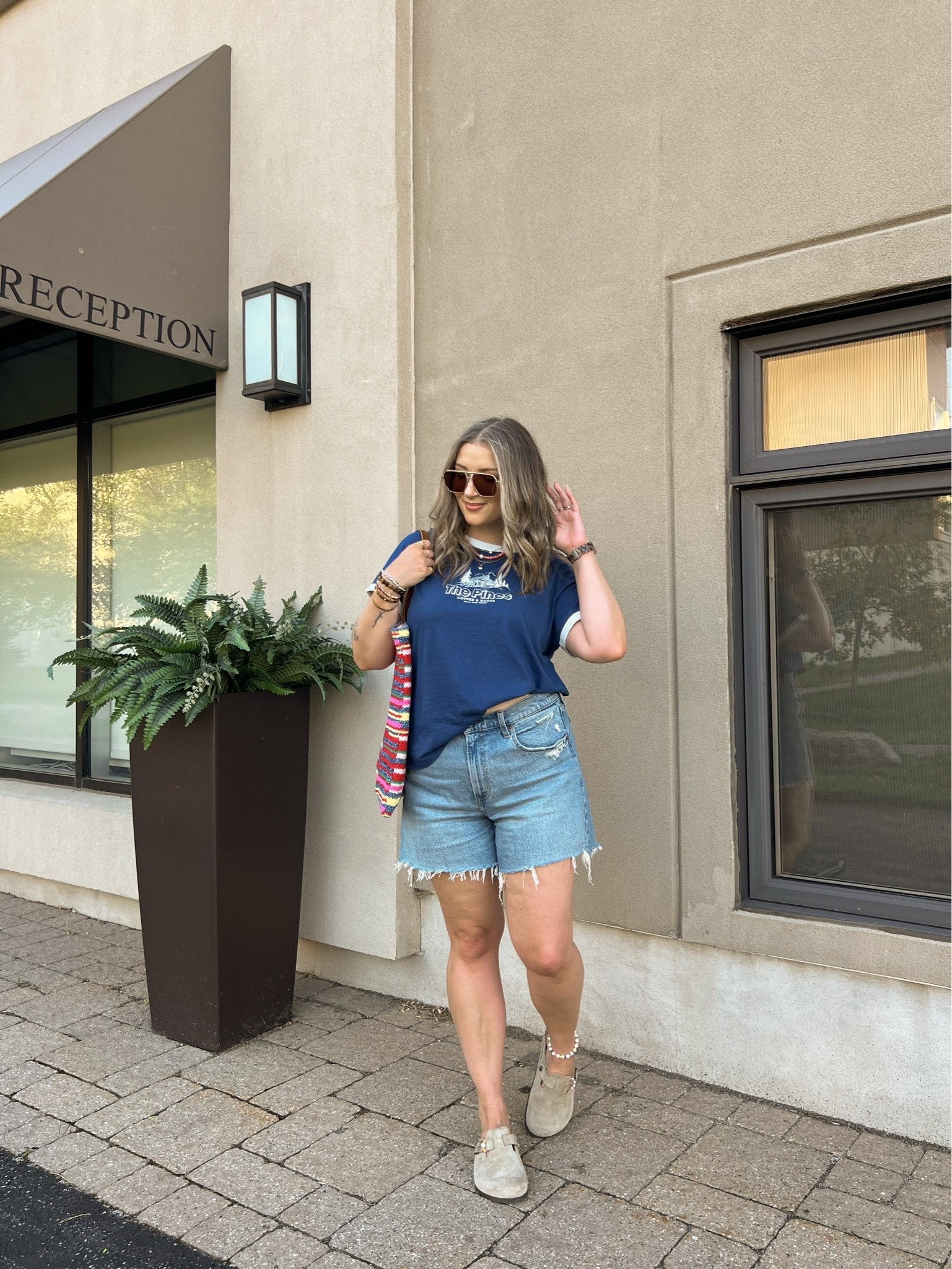 Casual summer outfit!! Sized up to XL in the graphic for an oversized fit. Canadian tee & tote bag links under “similar products”. Also sized up to 32 in the denim shorts for a loose fit. Birkenstock clogs are super comfy, I’m a 9.5-10 shoe and wear a 40.

#LTKsale #LTKmidsize #LTKsummer