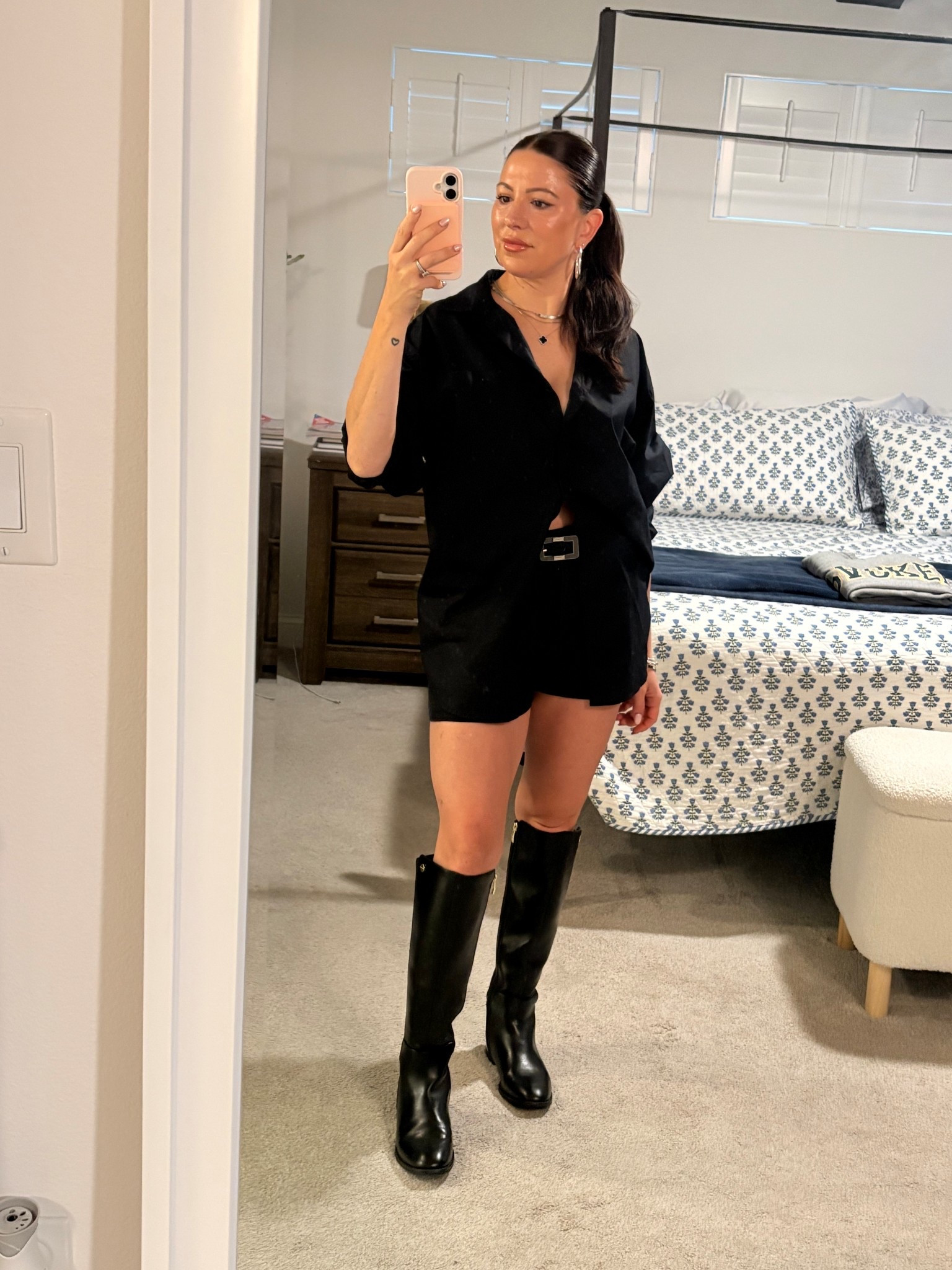 Rainy days but make it edgy, polished, and a little dangerous ☔️🖤

Who said you need bulky rain gear to stay dry? This look is all about contrast…sleek, structured, and just the right amount of skin.

• Oversized black button-down worn as a mini = effortless + sexy  
• Belted at the waist to create shape (trust me, this makes it)  
• Classic knee-high riding boots = practical and powerful  
• Slicked-back hair + gold jewelry for that clean, expensive finish  



Sizing for reference: 5’0” | 117 lbs | short torso, long legs  

Shop everything linked below ⬇️ and save this for your next rainy day outfit 🖤

#LTKOver40 #LTKootd #LTKmomlife