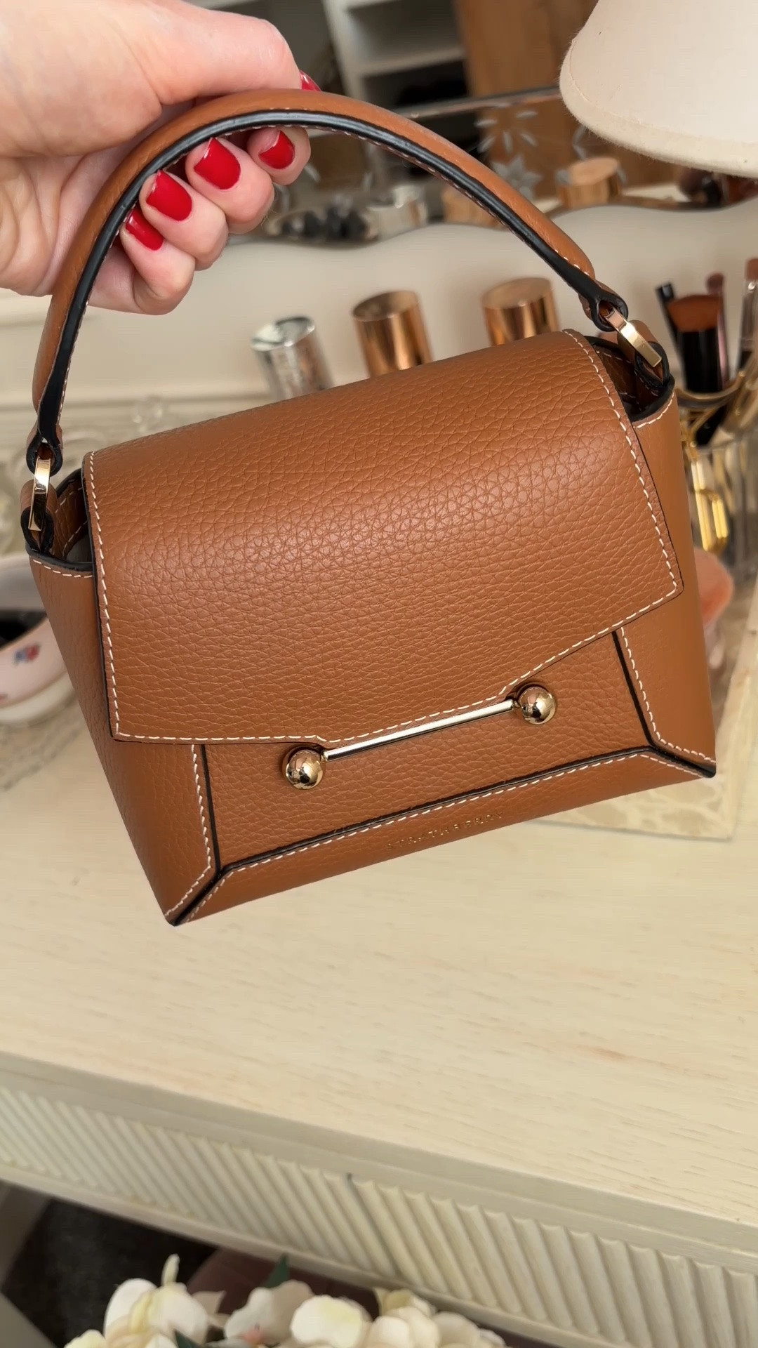 Re-sharing what fits inside my Strathberry Mosaic Nano bag and two ways to wear it  🤎👜

My colour isn't included in the sale, but selected colours are currently up to 35% off. This is genuinely one of my most-used bags it's compact but fits a surprising amount, and I love that you can wear it with the top handle for a more polished look or attach the crossbody strap for everyday wear. It's such a timeless style that goes with everything, and I find myself reaching for it again and again. ✨ @Strathberry

#LTKuk #LTKsale #LTKbag