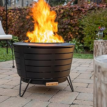 TIKI Patio Smokeless Outdoor Fire Pit, 25-Inch Wood-Burning Bonfire with Removable Ash Pan, Stand... | Amazon (US)