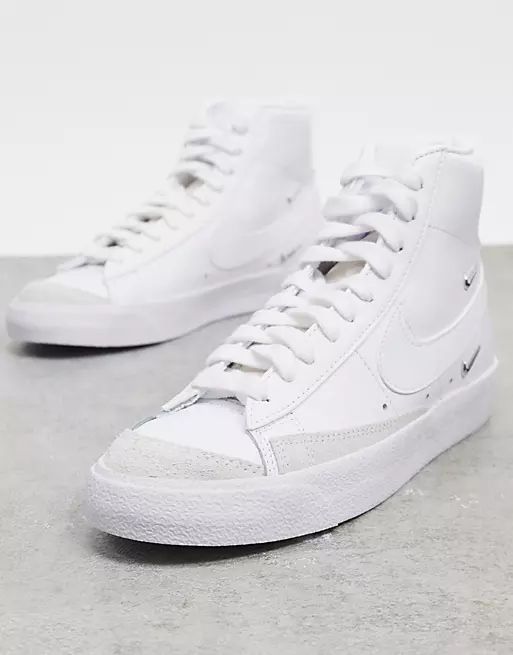 Nike Blazer Mid 77 trainers with metallic mini swoosh in white | ASOS (Global)