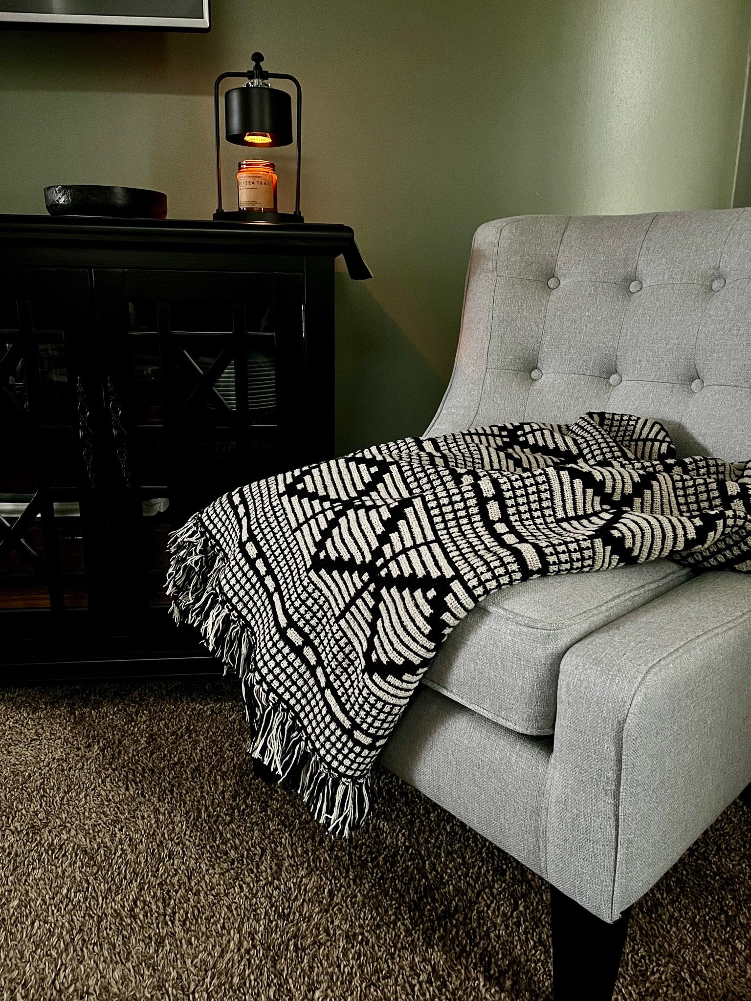 We added a comfy seating corner in the living room to accommodate guests over the holidays. 

Now that they're gone, I like to curl up here with my coffee and book in the mornings. 
