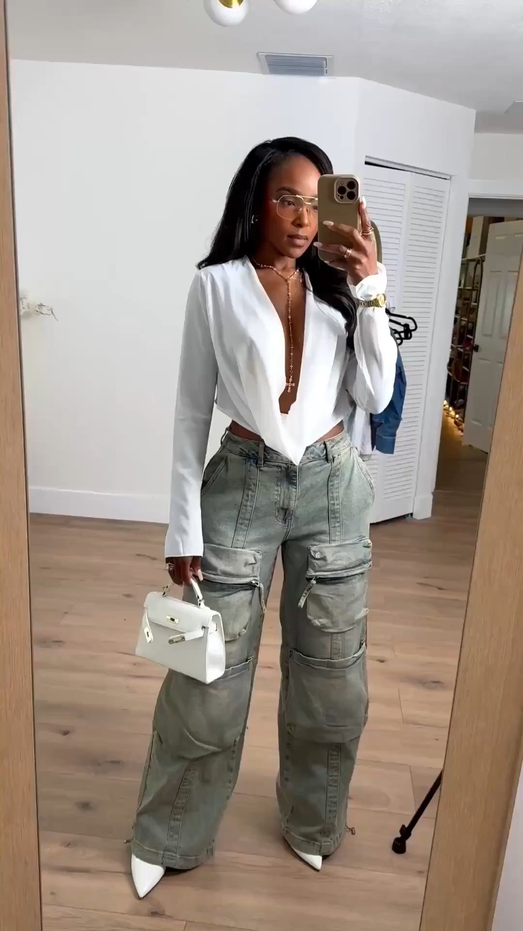 This outfit is a perfect example of how elevated basics can work overtime in your wardrobe. The structured white top paired with utility-style cargo pants creates an effortless balance that’s polished but still wearable. Styled multiple ways, this is one of those looks where the cost per wear drops fast.

Perfect for brunch dates, casual workdays, city errands, or styled up for dinner with heels.

📏 Sizing:
Top: Size Small  
Pants: 27 Long / 4 Long  
Shoes: True to size  

📐 Measurements:
Height: 5'4"  
Weight: 138 lbs  
Bust: 34D  
Waist: 27"  
Hips: 40"  

Save this post so you can come back to it later — this is one of those long-term shopping strategy outfits that works season after season.

SEO keywords naturally included: white deep v top outfit, cargo pants outfit women, neutral everyday outfits, elevated casual style, fall capsule wardrobe staples, versatile outfit ideas, cost per wear fashion.

Follow me on Instagram and YouTube @kirasfashionfinds 

#LTKPetite #LTKgrwm #LTKootd