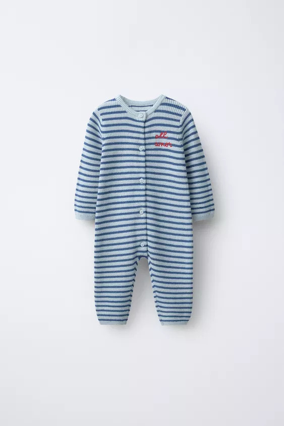 Knit jumpsuit with a round neck and long sleeves. Front button closure. Embroidered text detail o... | Zara US