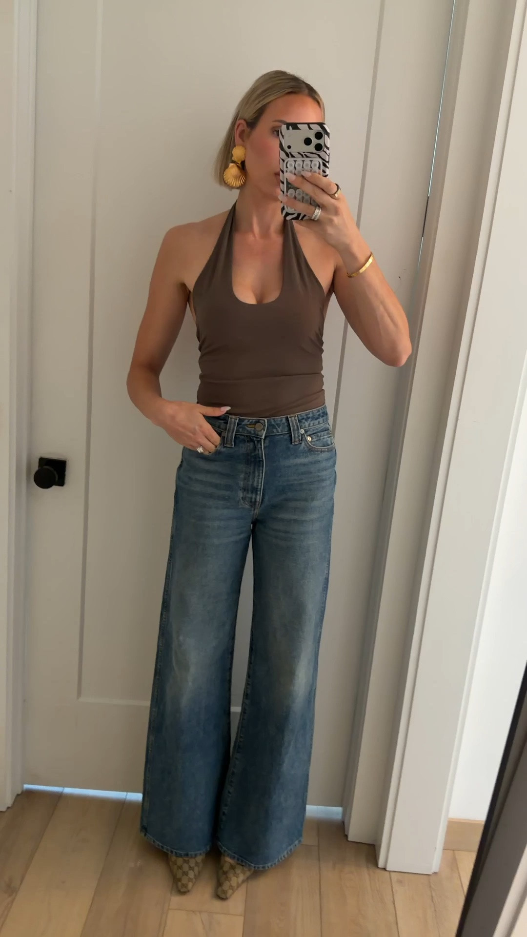 My outfit last night. I’m really loving this halter top! I’m wearing a small. But if you’re in between sizes, size up. Jeans run tts￼

#LTKootd #LTKdayinmylife #LTKgrwm