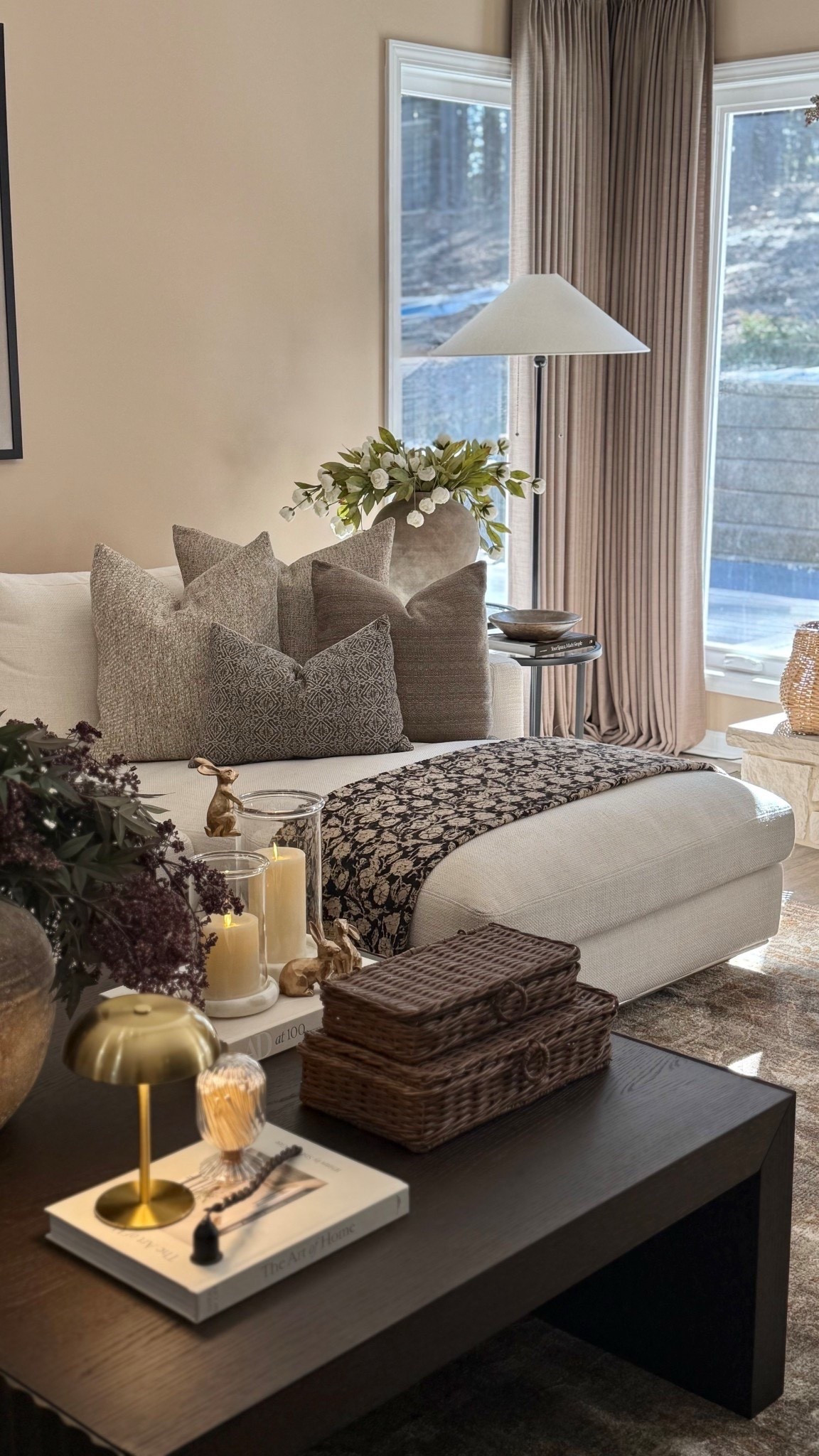 Give me all the sunshine ☀️ Follow @farmtotablecreations on Instagram for more cozy home inspiration and daily finds.

There’s something about warm sunshine pouring through the windows that instantly makes a space feel calm, cozy, and beautifully styled. My living room corner is layered with soft neutral pillows, a textured throw, and a mix of warm brass accents and woven elements that add depth and warmth. The sunlight hitting the pillows and florals creates the prettiest glow, making this the perfect spot to relax with a cup of coffee or unwind at the end of the day.

Everything here blends texture, warmth, and timeless pieces that make a space feel collected rather than overly styled. From the woven baskets to the soft neutral textiles and warm lighting, these pieces work beautifully together to create that cozy, lived-in feel.

#livingroom #sectional #pillows #throwblanket #coffeetabledecor #livingroomrug #coffeetable #livingroomfurniture #homedecor #neutraldecor



#LTKHome #LTKSaleAlert