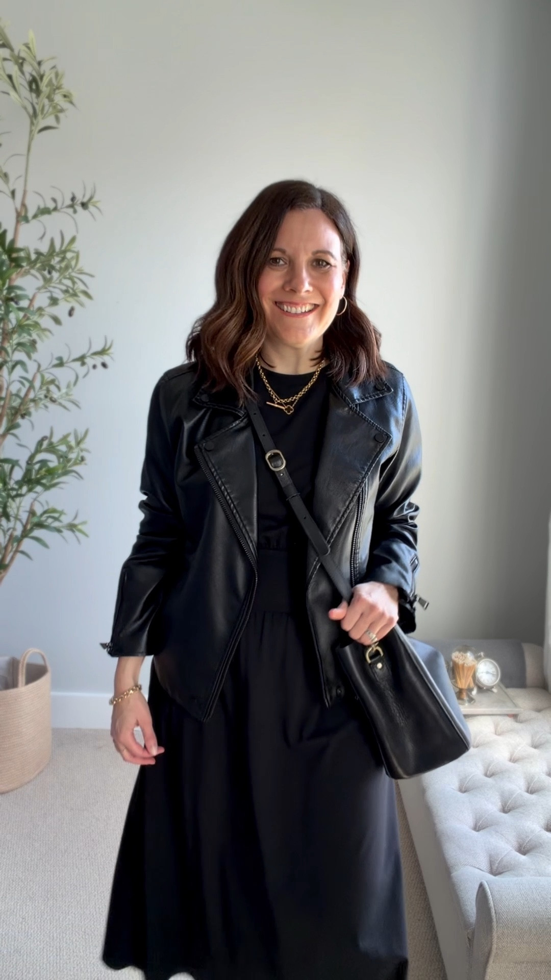 A black leather jacket adds just the right amount of edge to a feminine dress. Loafer mules are a slightly unexpected choice that keeps the look grounded and a bit warmer on cooler nights. A black bucket bag pulls it all together. This dress fits tts, I’m in a small. 

#LTKOver40 #LTKSeasonal #LTKSaleAlert