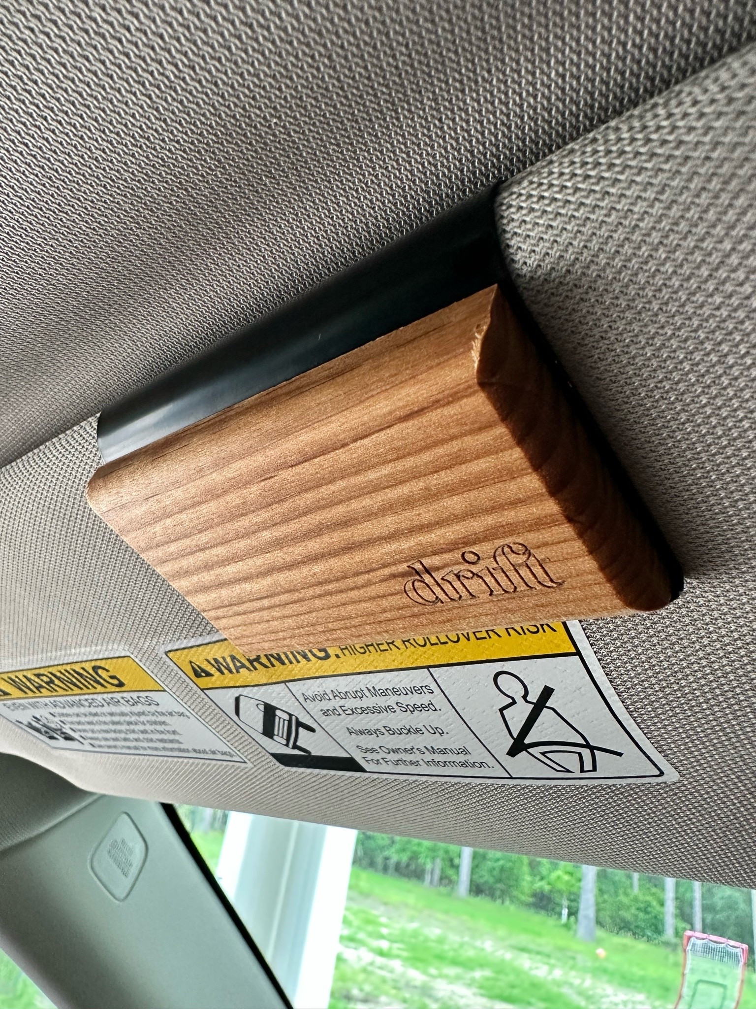 Car air freshener 
Wow does this smell luxurious and look so sleek! So simple. The refills have a magnet on the back and it just snaps onto the black metal visor clip. This is the teak in the new car smell scent!