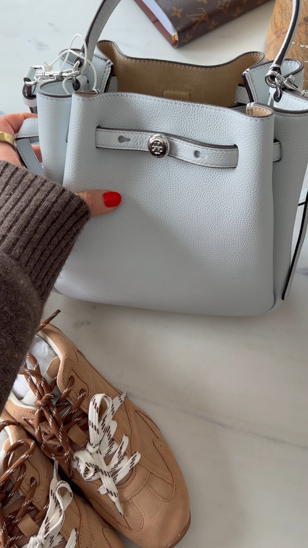 Loving this color for spring! The bag is the perfect size, pebble leather and top handle along with with an adjustable strap! Under $400 - sneakers are giving miu miu for a fraction of the cost! 

#LTKootd #LTKOver40 #LTKSeasonal