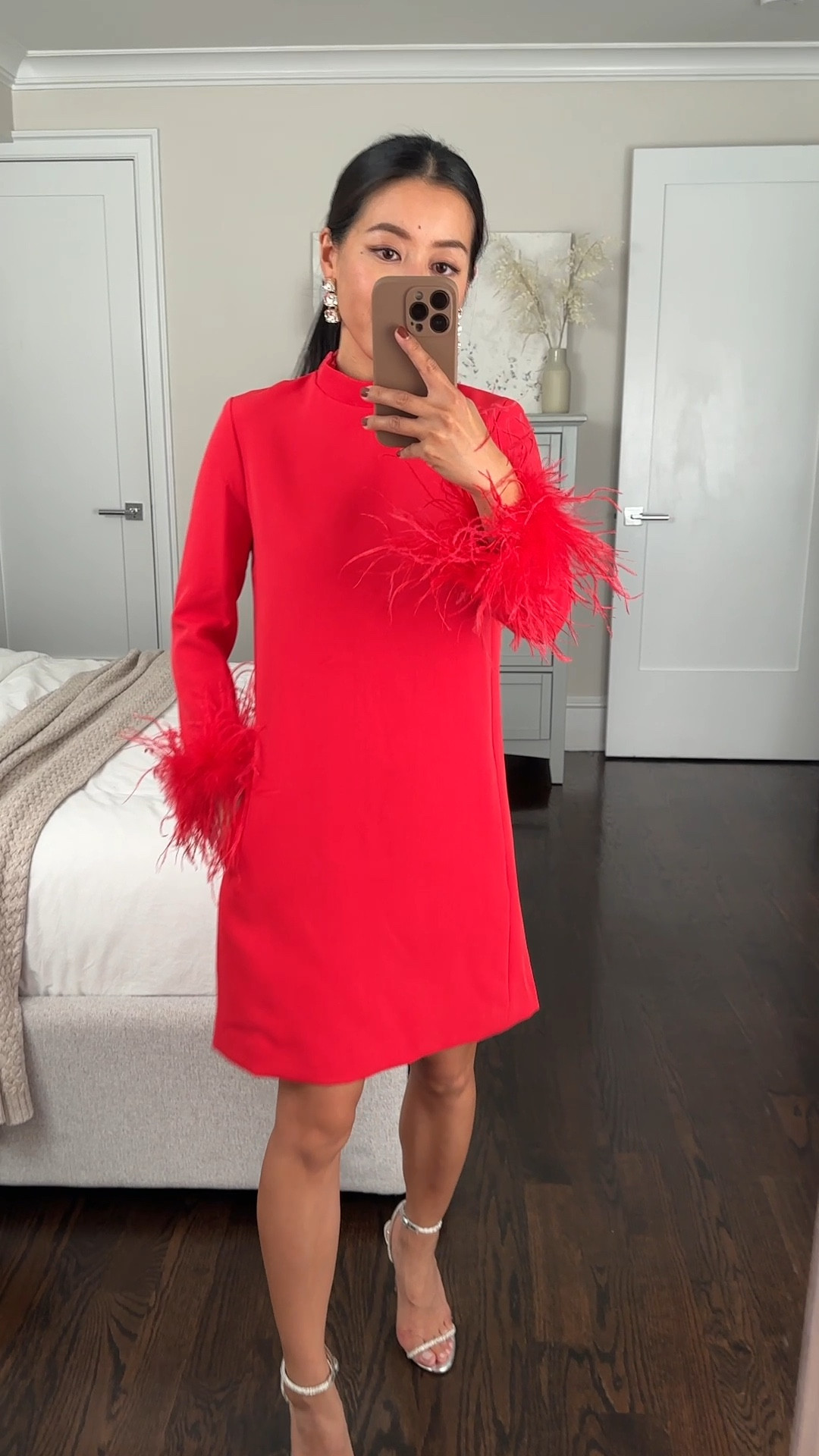 Trying on a different color - debating between this or black!

Feather trim sheath dress size 00 With pockets. Size 00 Measures 17” armpit to armpit, 33.5” dress length, and 19” sleeve length.

Thicker, nice quality structured fabric with a full lining and pockets! Zipper back and Velcro adjuster at the neckline to make the mock neck a comfortable width. 

Bracelet length sleeves work surprisingly well for petites. 

Length hits above the knee on me (5ft) and is modest for an office party or work event. I like my dresses about 2 inches shorter for a mini length, so may hem this. There’s a few petite customers in the online review photos modeling the different colors! 

• old simmi London silver sandals  

• Would pair this with my Amazon rhinestone party bag (linked) I tried a similar bag that was 10x the price and this one is better with a little slouch and a petite friendly size. 

Petite friendly, lunar Chinese new year, winter wedding, office holiday party, Christmas event, family photos dress  

#LTKParties #LTKSeasonal #LTKHoliday