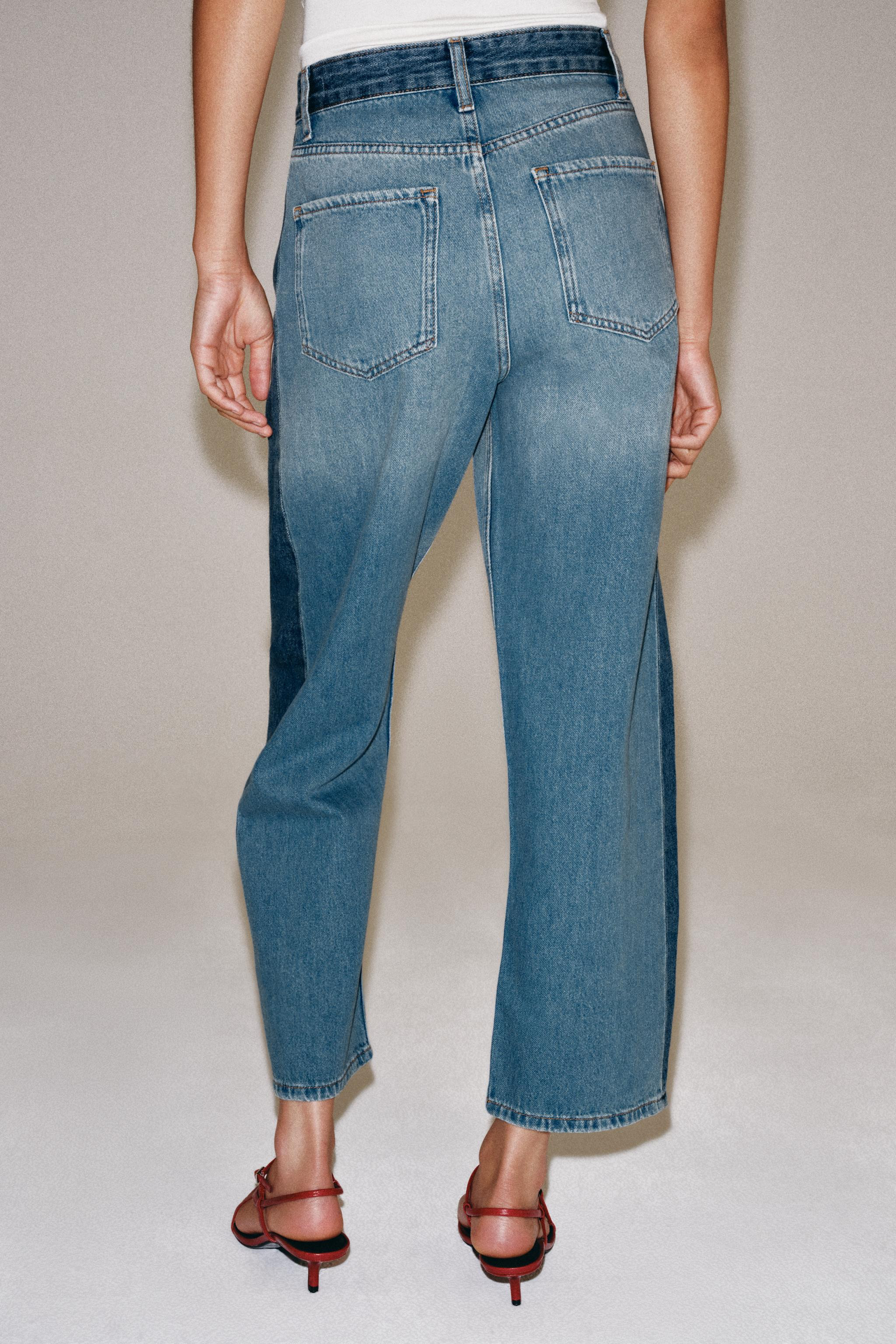 ZARA WOMAN COLLECTION Mid-rise jeans featuring belt loops and five-pocket styling. Contrasting de... | Zara US
