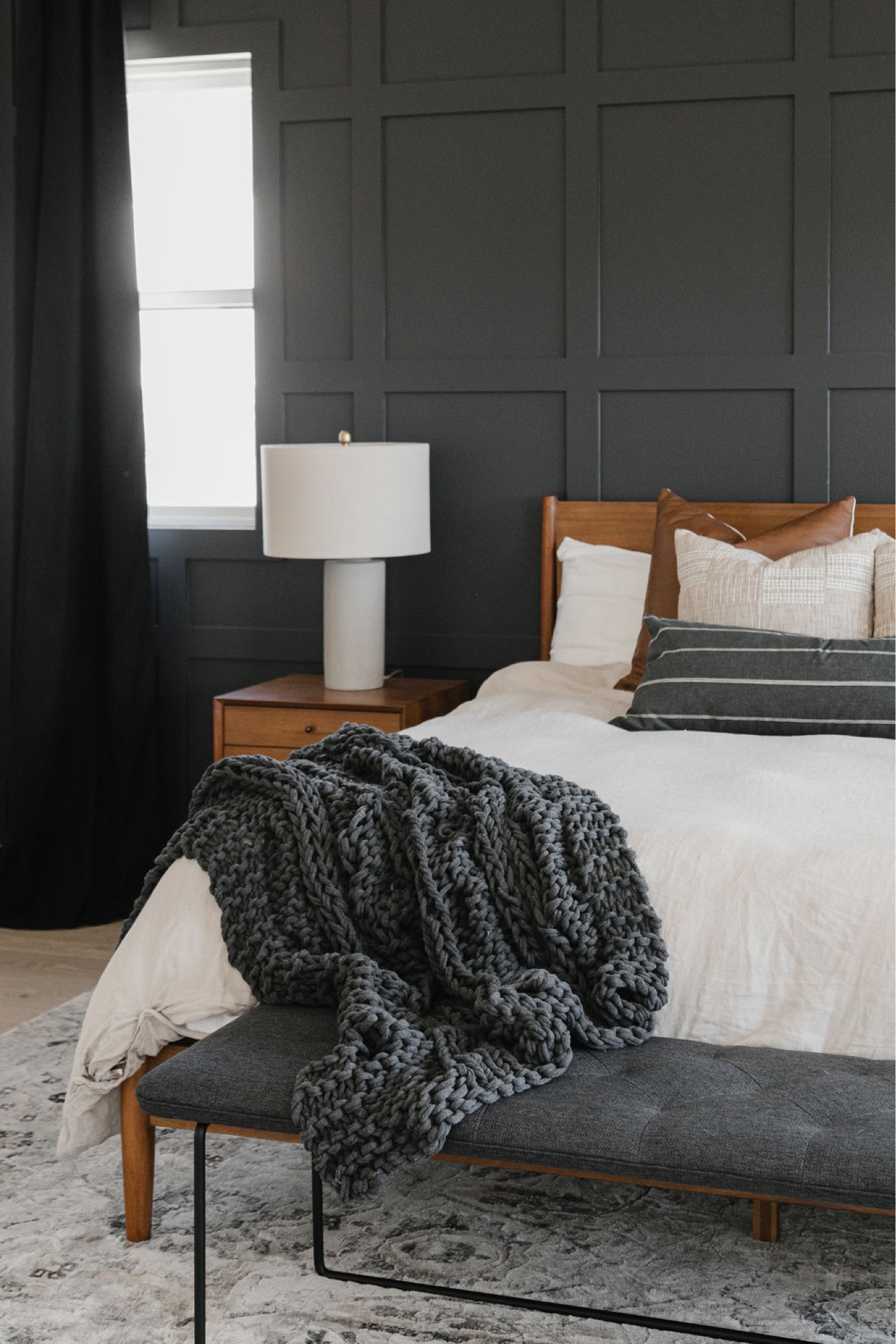 Moody primary bedroom with mid-century elements and cozy textiles. 

mid-century,  home decor, bedding, moody bedroom, rug, bedroom rug, side table, lamp, pillows, decorative pillows, bench. 

#LTKhome #LTKunder50 #LTKunder100