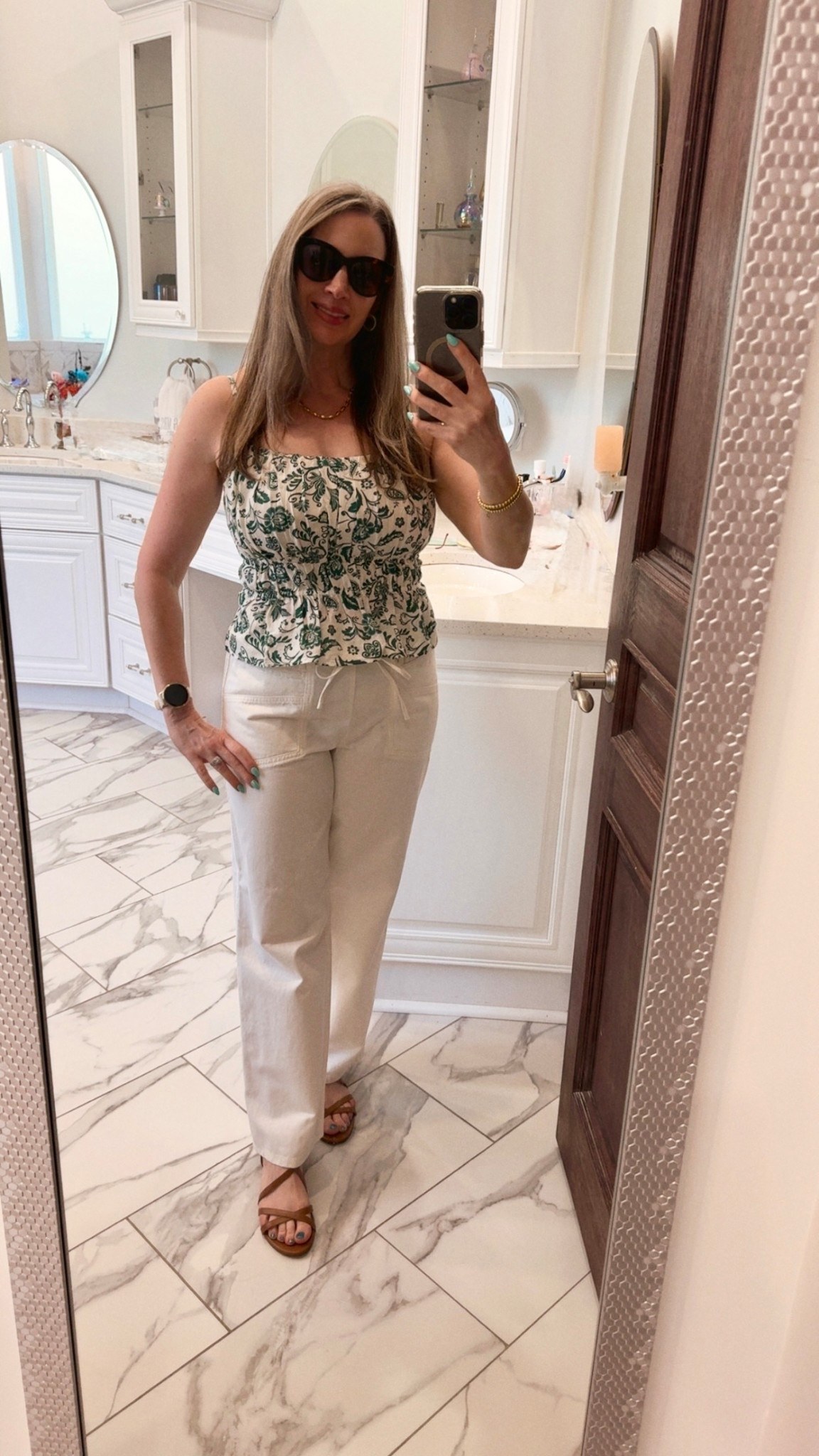 These pieces come together to create the perfect date night outfit for a warm spring evening. I never imagined I’d love the shorter tops we’ve seen in stores, but they are incredibly flattering for petite women. I’m wearing a regular size small in the top. And I also never thought I’d wear paper bag pants, but when they’re cut right and fit nicely, they become a staple in any wardrobe. These have a handy removable drawstring. Since I’m an hourglass, I had to do a little shimmy to get the pants over my hips, but once they were on, they felt fantastic. I’m wearing an extra small for the perfect fit. 

#LTKdayinmylife #LTKootd #LTKOver40