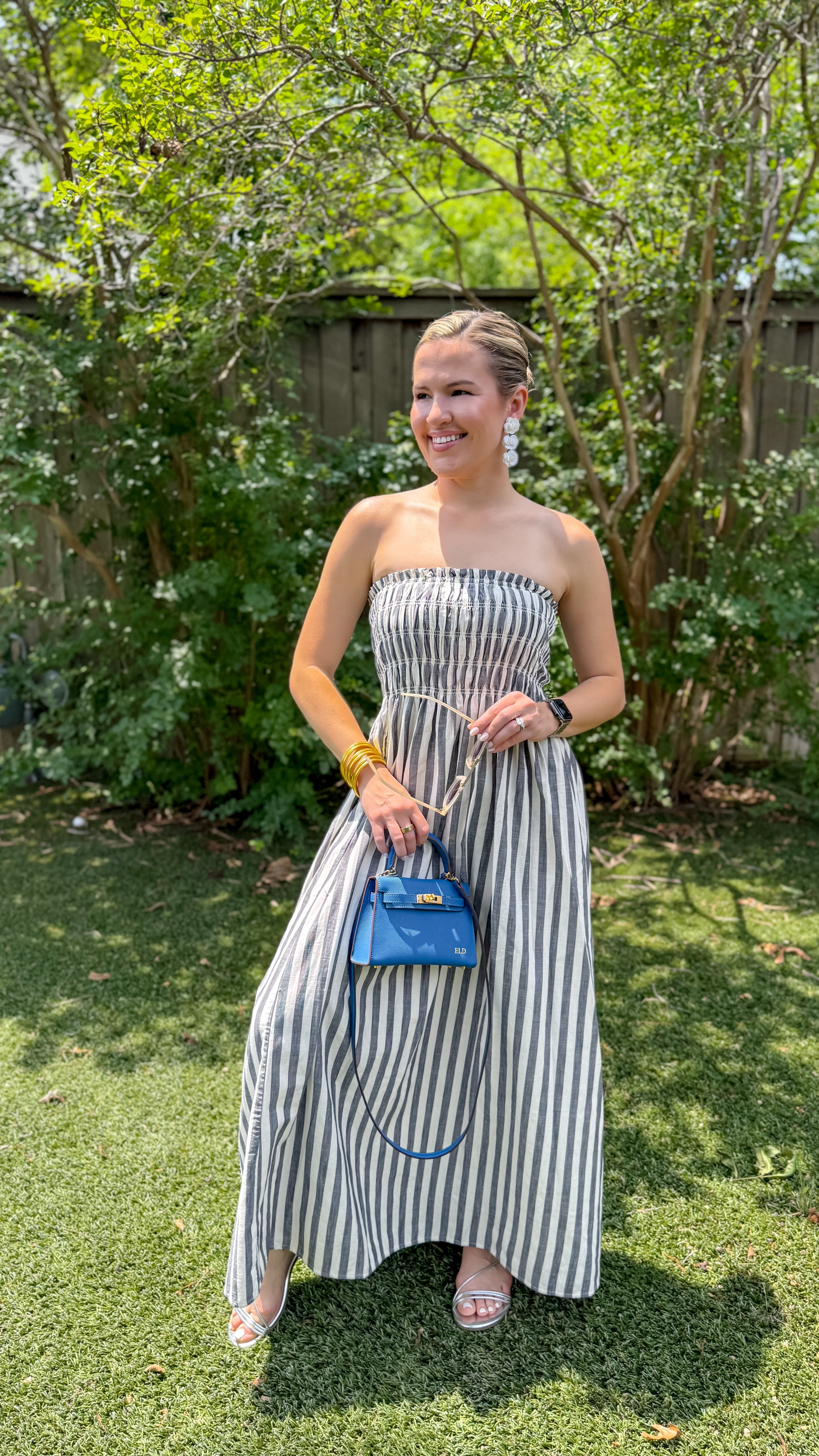 $30 people…this strapless striped dress is the cutest summer staple styled with strappy sandals. AND there it has pockets!🫶🏼🤍 inspo from @bobbiwiththeeye 

comment “SUMMER” and I’ll send you the link to this fabulous dress!🔗

#summerfashion #afforablefashion #targetstyle #summerstyle #tryonhaul #affordabledresses #vacationdress