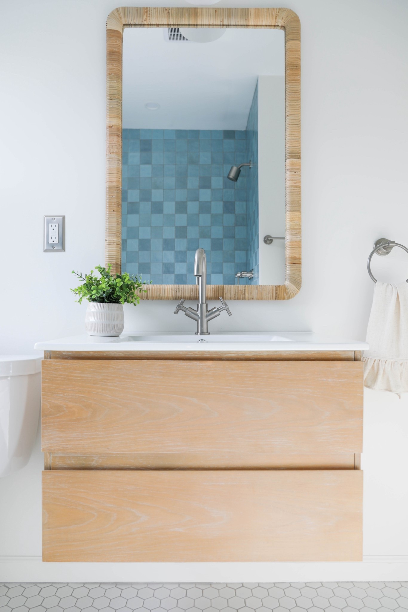 This blue tile brought in just the right pop of color and texture to this bathroom. I linked similar, zellige  inspired, tiles here. 
 
