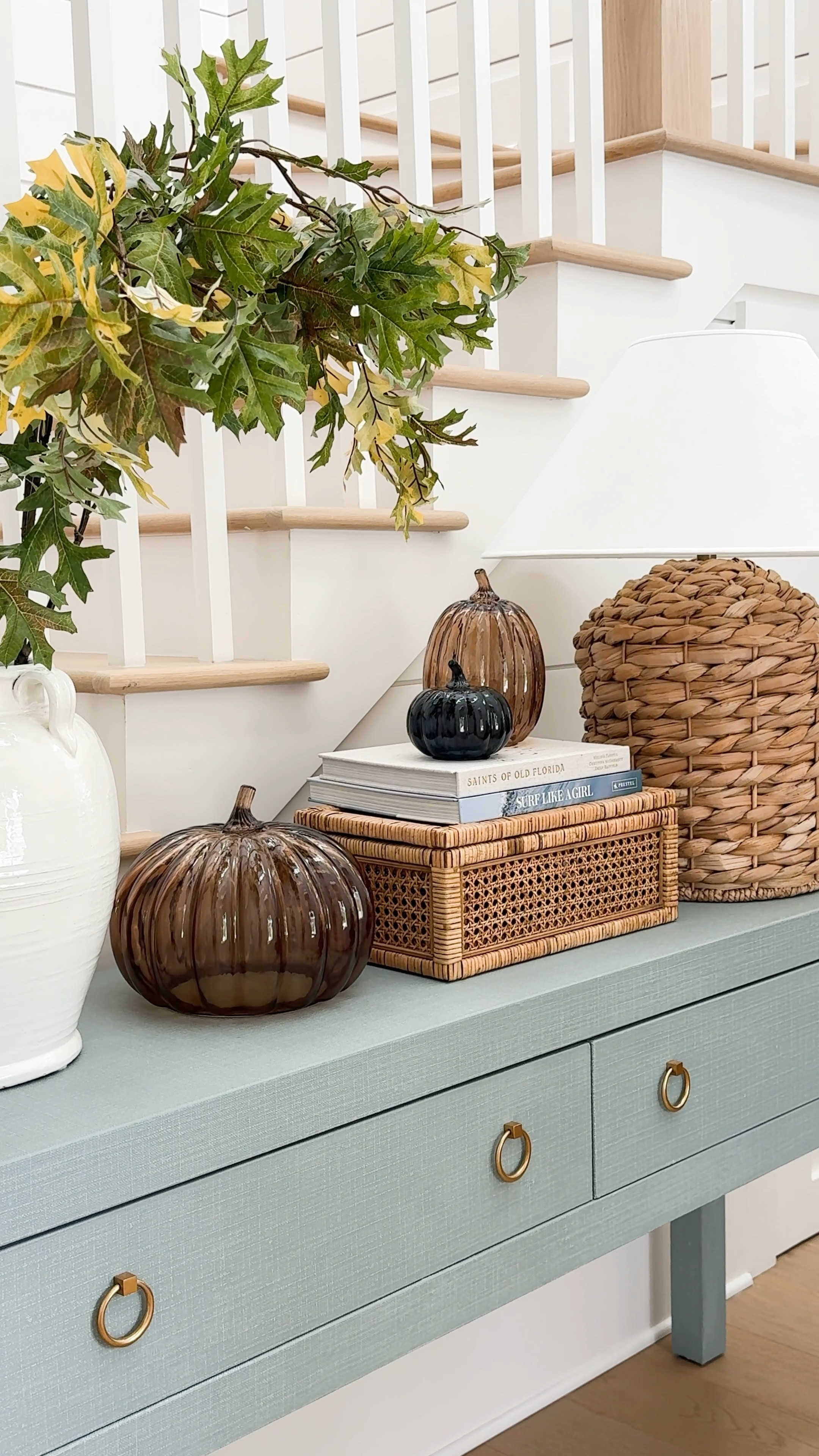 I’m not much of a pumpkin decor girl in the fall, but I love these brown and navy blue glass pumpkins so much! They’re perfect in our fall entryway that also includes a blue linen console table, faux oak leaves, and a seagrass table lamp.
.
#ltkhome #ltkfindsunder50 #ltkseasonal #ltkstyletip #ltksalealert #ltkfindsunder100

#LTKVideo #LTKHome #LTKHalloween