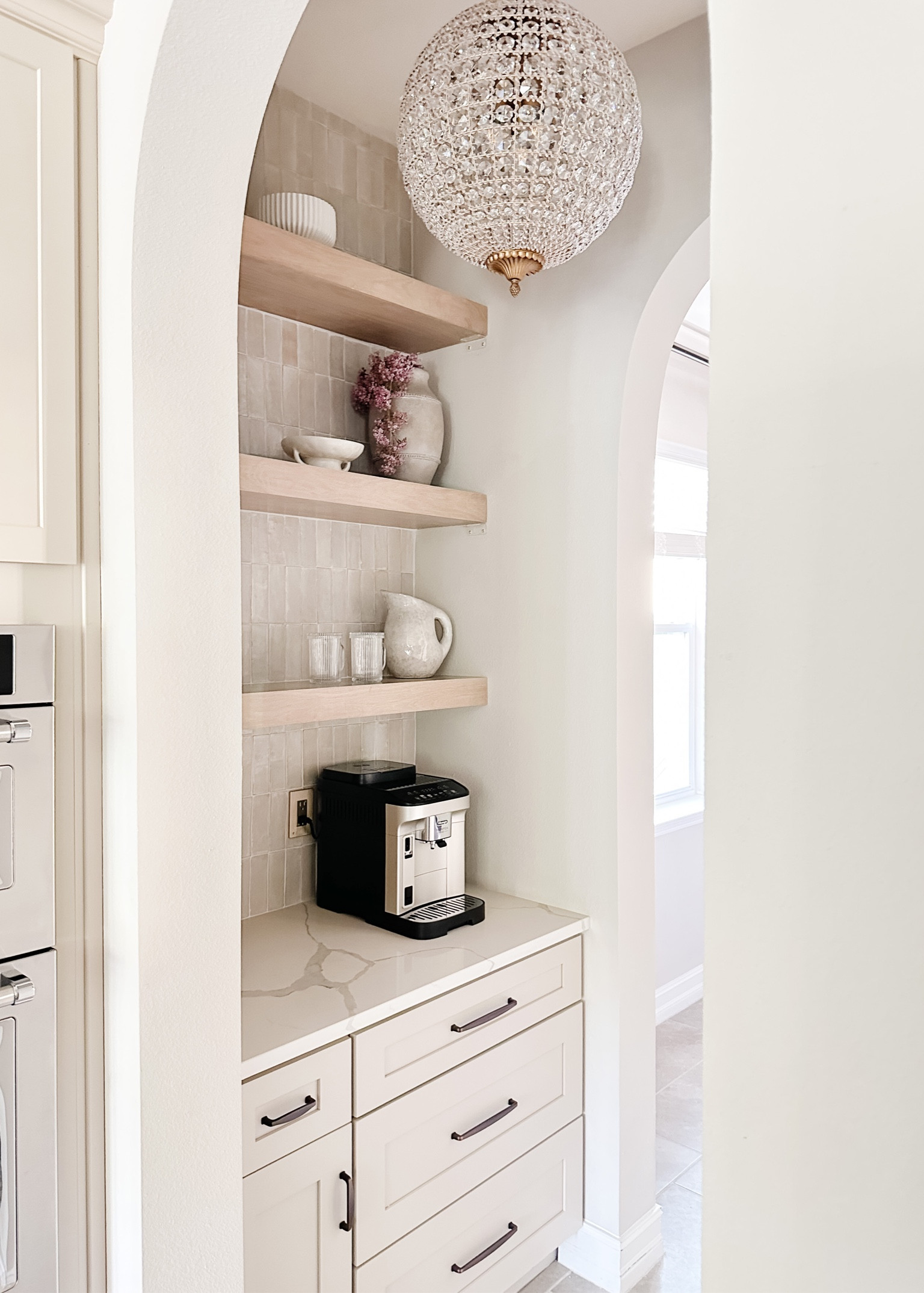 Our DIY coffee bar is complete! Links to all the pretty details✨


Ultrashelf, floating shelves, glam chandelier, pottery barn chandelier, glazed stoneware, target vase, Walmart planter 

#LTKunder50 #LTKhome #LTKFind
