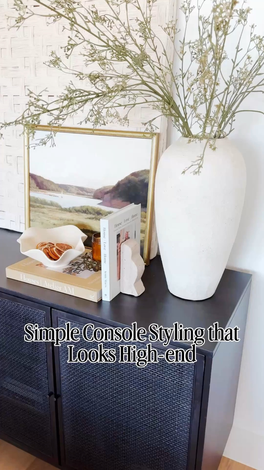 Simple console table styling that feels high-end without overcomplicating your space. I love using a neutral color palette, layered coffee table books, sculptural decor, and organic stems to create a clean, designer-inspired look that works in any living room or entryway. This is one of my go-to styling formulas when I want something minimal but still warm and elevated. Everything is linked if you want to recreate this look in your home, and follow me on LTK for daily home decor, Amazon finds, and styling ideas. I love mixing high end with affordable organic modern decor  

#LTKvlog #LTKSaleAlert #LTKHome