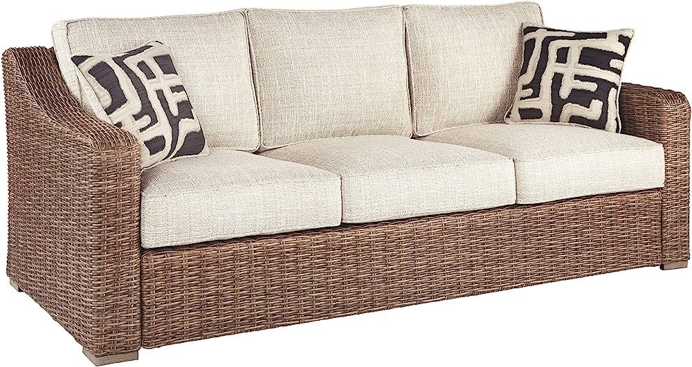 Signature Design by Ashley Beachcroft Outdoor Wicker Patio Sofa with Cushion and 2 Pillows, Beige... | Amazon (US)
