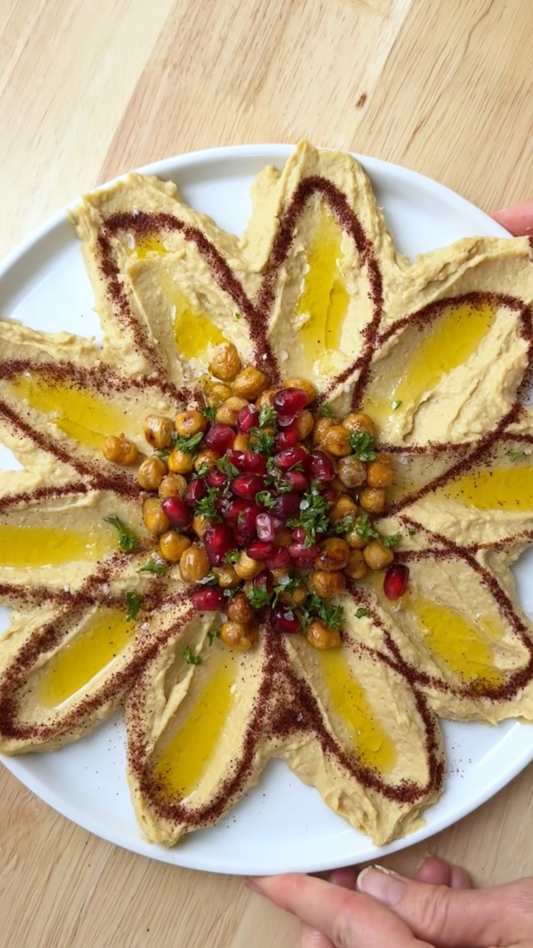 🌸 Dressed up store-bought hummus flower! Ps- Comment HUMMUS if you want the recipe sent to your DMs & the Spice pen info.

I was inspired by @mackenziebiehl’s viral post showing off her hummus flower. This is my take on the fun idea 🌸

INGREDIENTS

17 oz hummus (I used most of this family size tub)
1 can chickpeas (you’ll use about ⅓ or less of these)
2 oz pomegranate arils
1 ½ tbsp sumac
2 tbsp parsley, chopped
olive oil, to taste
flakey salt, to taste

INSTRUCTIONS

1. Preheat oven to 425 degrees Fahrenheit.
2. Fully dry the chickpeas after rinsing, and spread on a baking sheet lined with parchment paper.
3. Dress with olive oil and salt, and bake for 20-30 minutes, or until chickpeas are slightly browned and crispy. Set aside to cool.
4. Spread hummus on a platter into petal shapes by starting from the center and spooning towards the edge of the platter.
5. Using the spice pen filled with sumac, draw a floral design along the hummus petals. If you don’t have a spice pen, just sprinkle some on at the center of the petals.
6. Add roasted chickpeas to the center, with pomegranate arils, and parsley. Top with olive oil and flakey salt, and enjoy!

#LTKSeasonal #LTKHome #LTKGiftGuide
