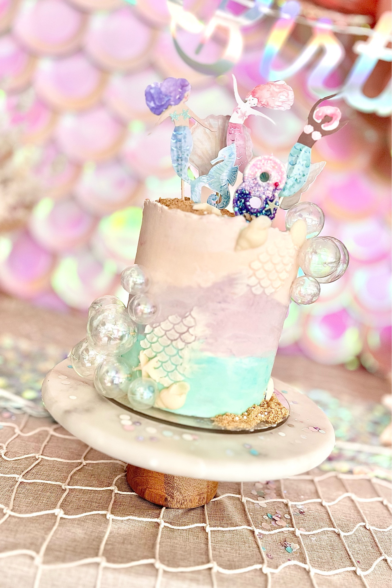 Mermaid cake and all our baking and decorating supplies 🧜‍♀️ including the seashell chocolate mold and the prettiest watercolor cupcake toppers! 

#LTKparties