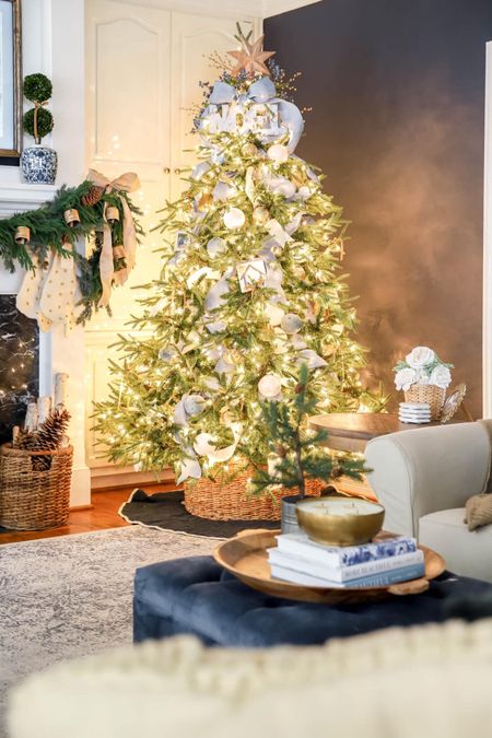 Our pre-lit Christmas tree takes center stage beside our fireplace and picture frame TV  

#LTKHoliday #LTKhome