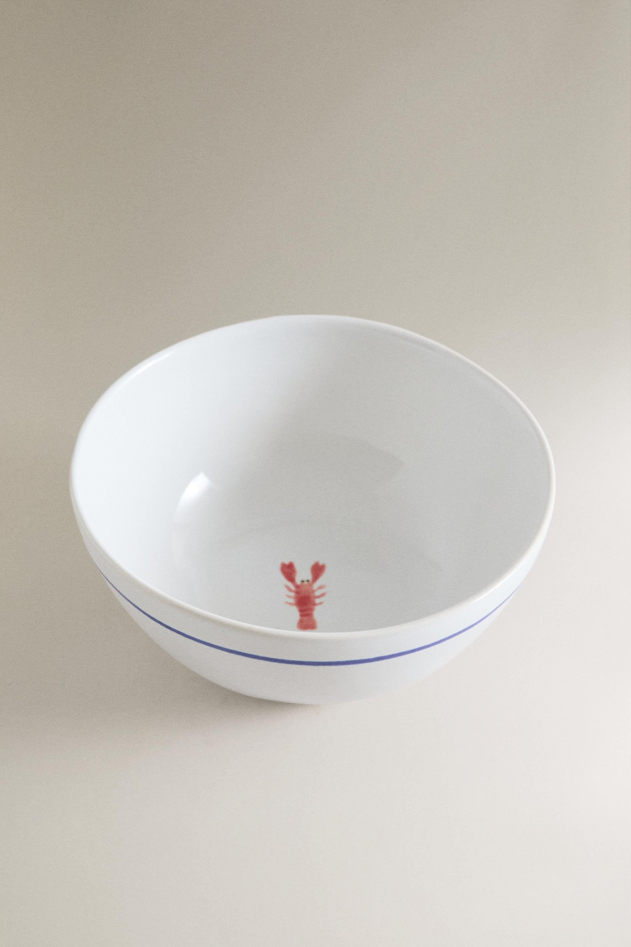 Stoneware bowl with a scalloped blue rim. Featuring a decorative lobster motif in the centre and ... | Zara UK