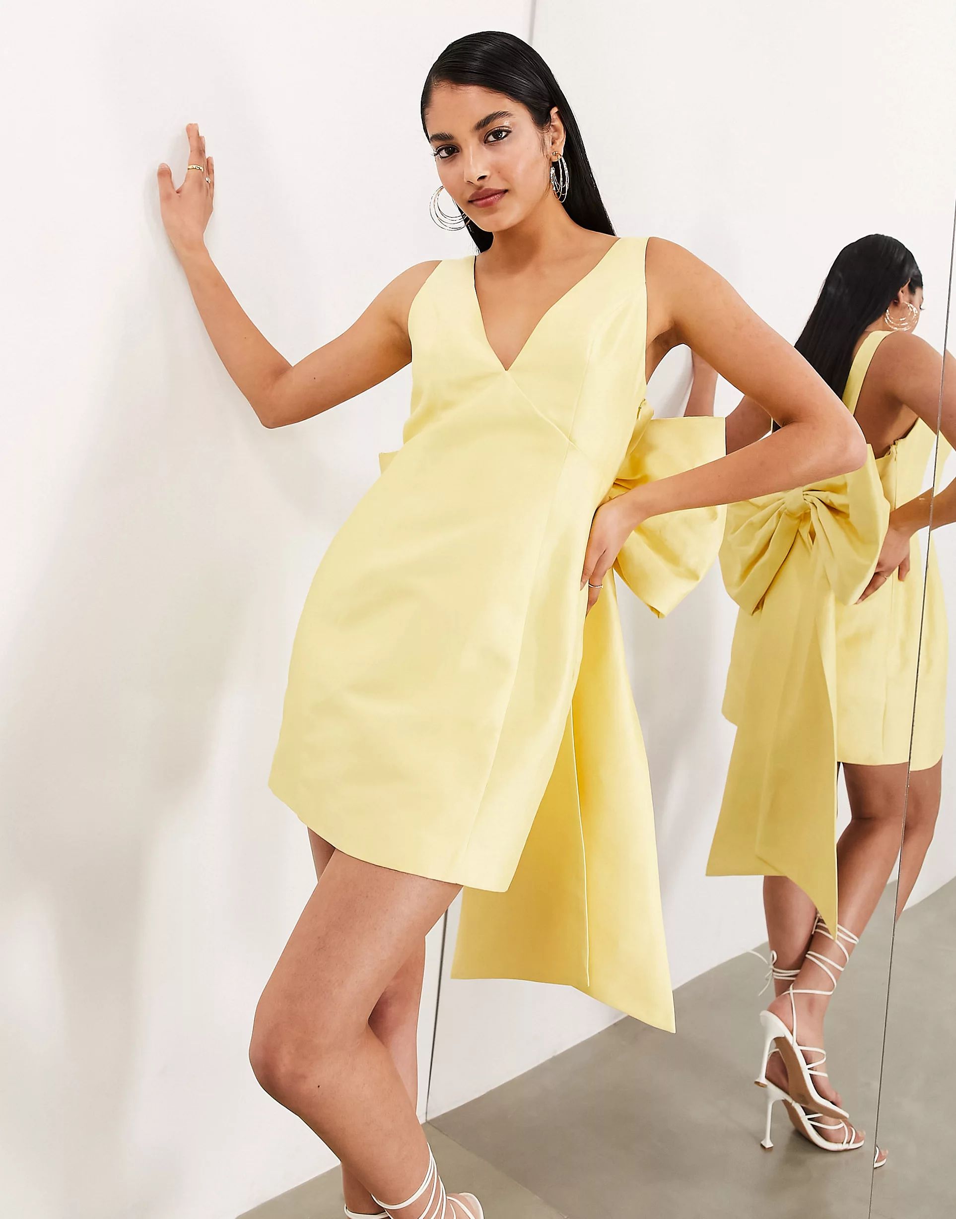 ASOS EDITION structured mini dress with statement bow back detail in yellow | ASOS (Global)