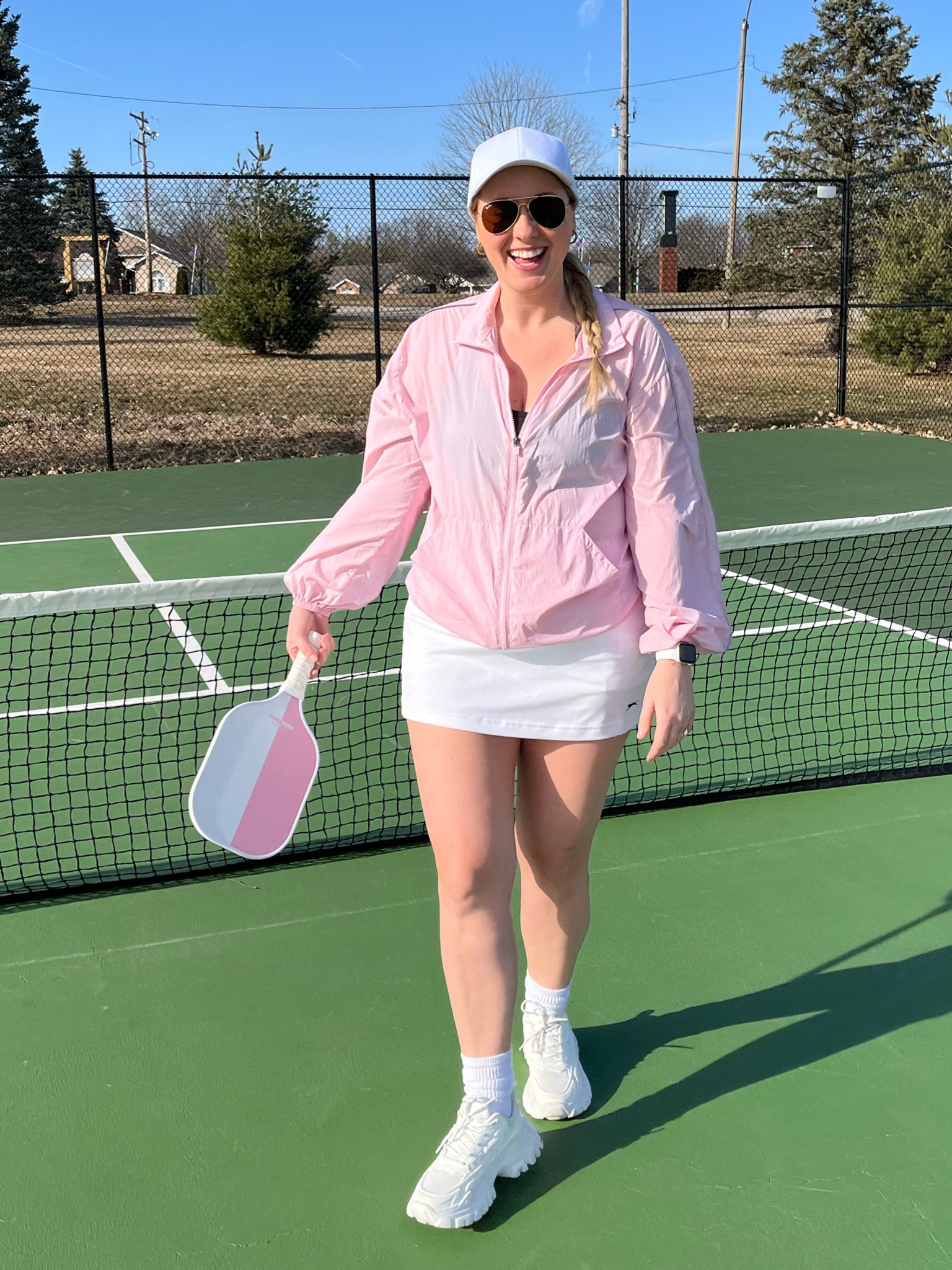Pickleball outfit, athletic outfit, gold skirt, tennis skirt, pickleball skirt, windbreaker, pink pickleball paddle 

#LTKmidsize #LTKfindsunder50 #LTKfindsunder100