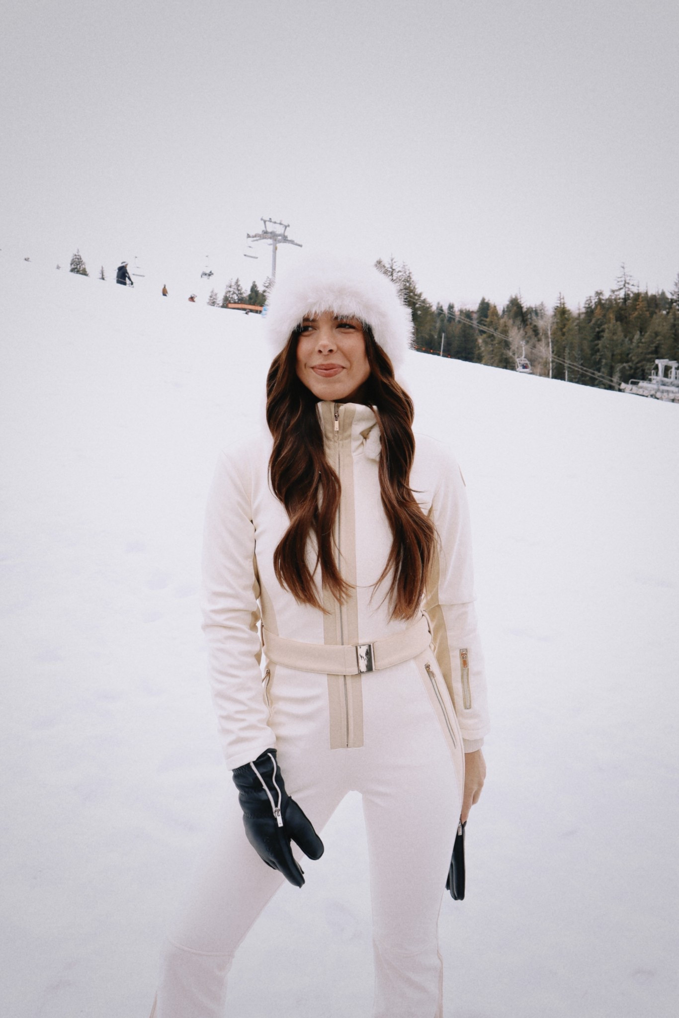 Suit isn’t available on LTK - it’s from My Sunday Ski (Velocity Gstaad Ski Suit in cream) & (Ribbed Base Layer Set in cream)  hat is the mink faux fur bucket hat 