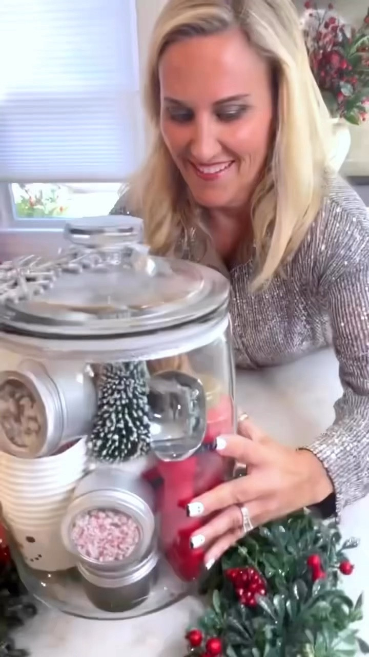 Create a festive and functional Christmas gift with this DIY holiday ice cream jar! Featuring a clear glass jar filled with snowman cups, peppermint and snowflake sprinkles, and chocolate topping! Drop in a red scoop and a charming bottlebrush tree for a cozy Christmas vibe.  All you need to do is top with a beautiful Christmas ornament and a tag that reads: “Just add ice cream!” 

#LTKFitness #LTKHome #LTKSaleAlert