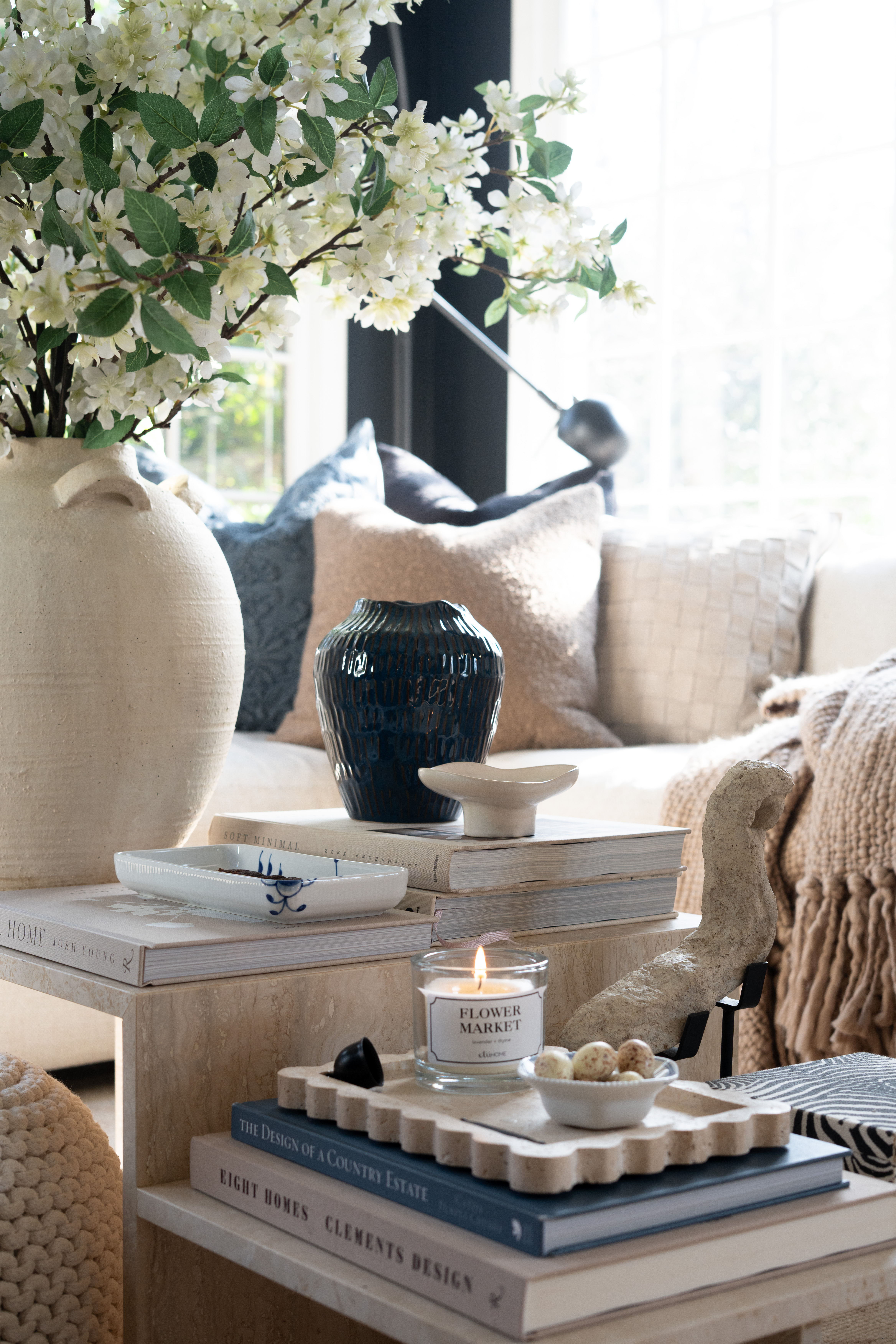 I’m honestly in love with how this space turned out. The fresh blossoms, neutral sofa, layered pillows, and warm textures create the dreamiest cozy living room moment. The soft light and styled coffee table make the whole space feel calm and inviting.  

 #LTKSpringSale #LTKSeasonal #LTKHome