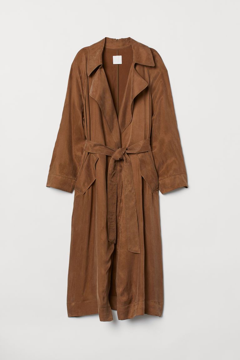 Lightweight trenchcoat in twill made from a cupro and viscose blend. Notched lapels, semi-attache... | H&M (US + CA)