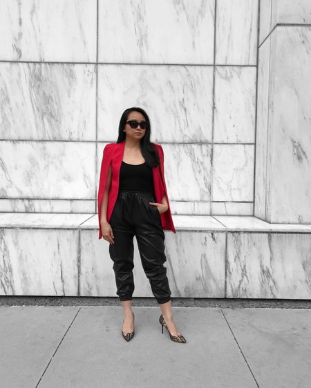A super easy holiday outfit is a red cape blazer, black tank top, and joggers.

Elevate your look with textures like lace pumps and (faux) leather joggers!

#LTKunder100 #LTKHoliday #LTKstyletip
