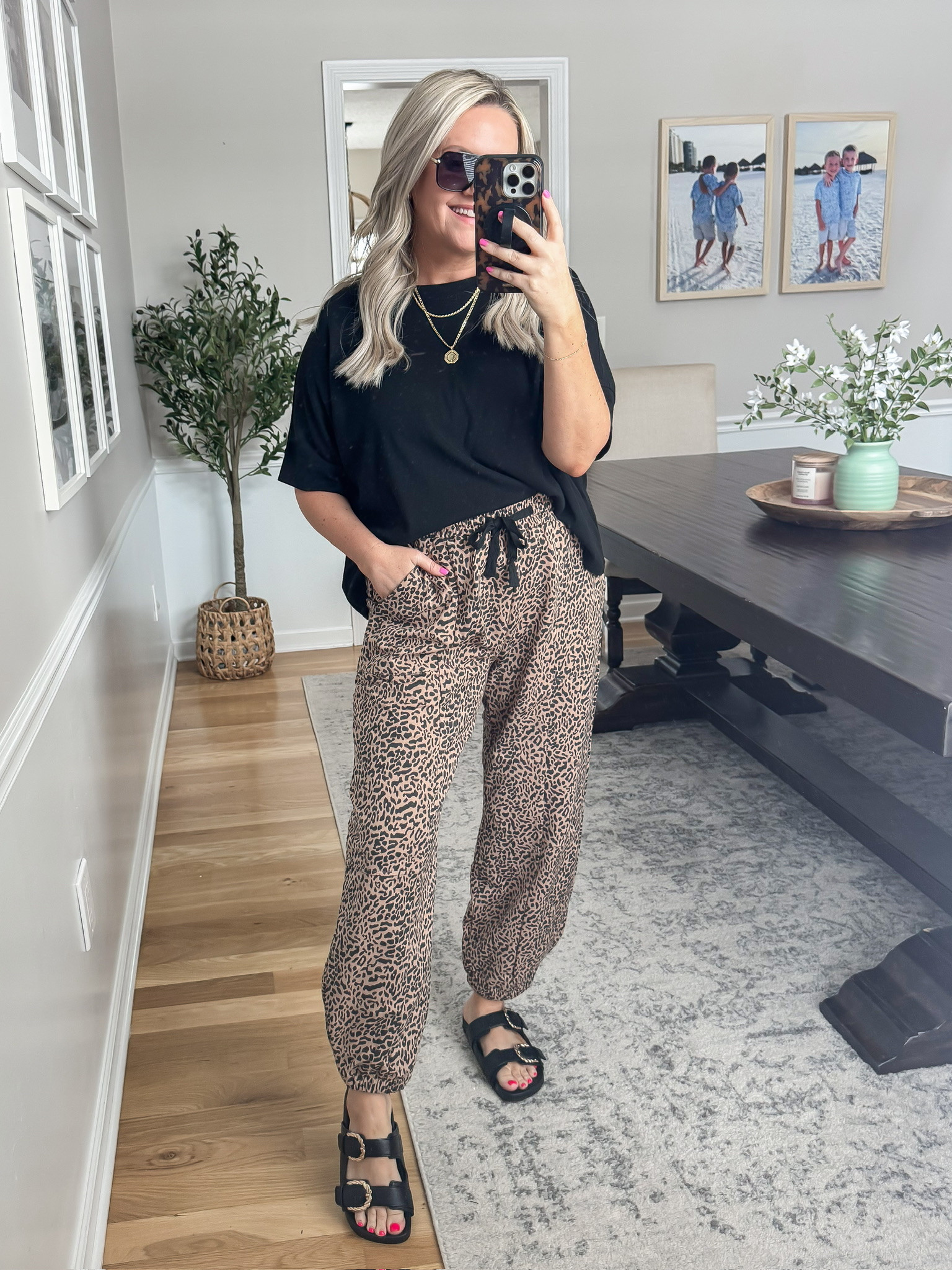 This outfit is such a fun mix of comfy and bold for spring. The leopard drawstring pants paired with a simple black tee and sandals make it feel effortless but still styled.

spring outfit ideas leopard pants outfit drawstring pants outfit black t shirt outfit black sandals outfit casual spring outfit comfy chic outfit everyday style statement pants outfit womens spring fashion lovelylifestyling

#LTKootd #LTKSeasonal #LTKOver40
