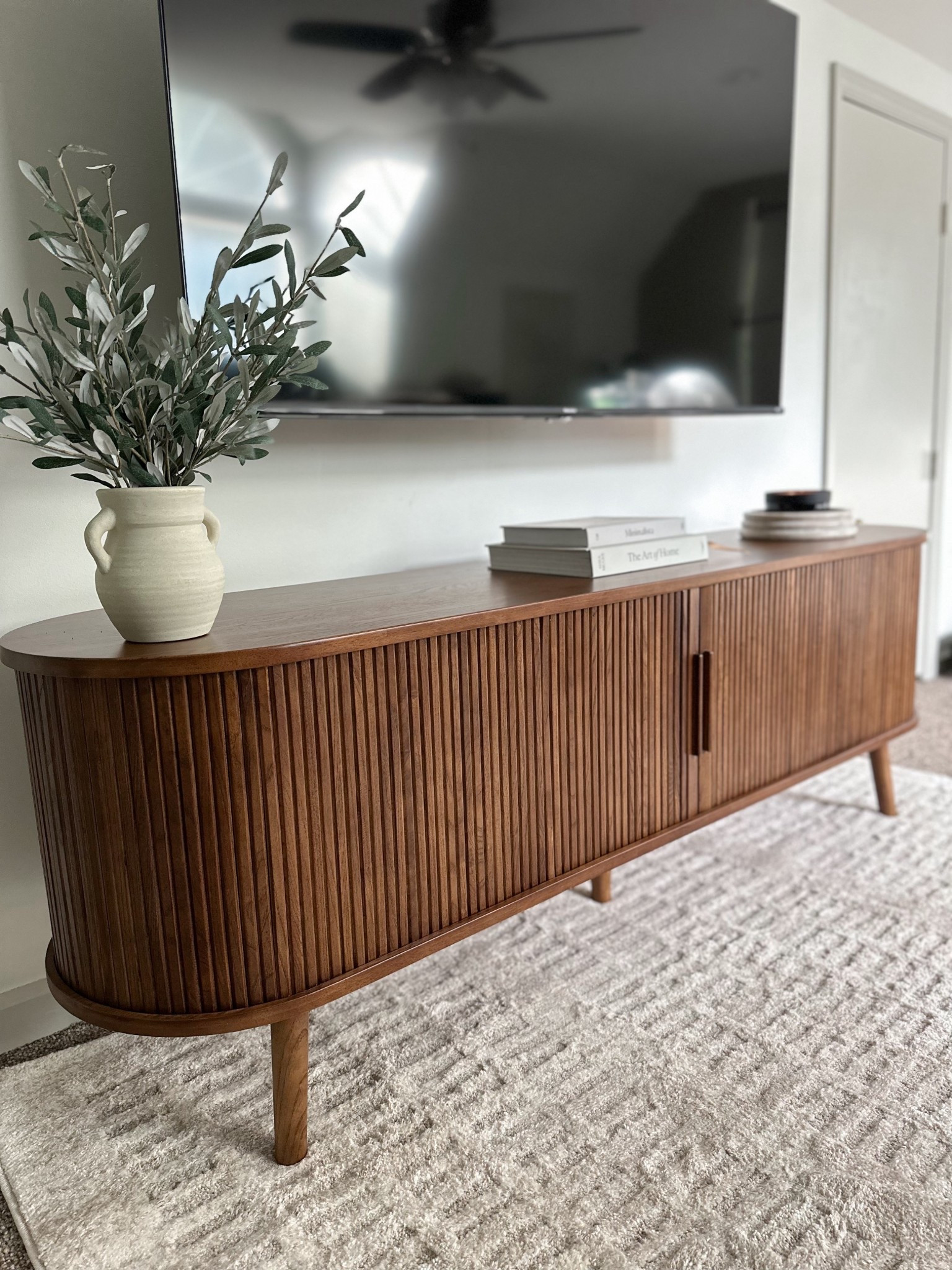 Loving this new media console for our bonus room! Solid wood and has tons of storage inside! 

#LTKSaleAlert #LTKHome
